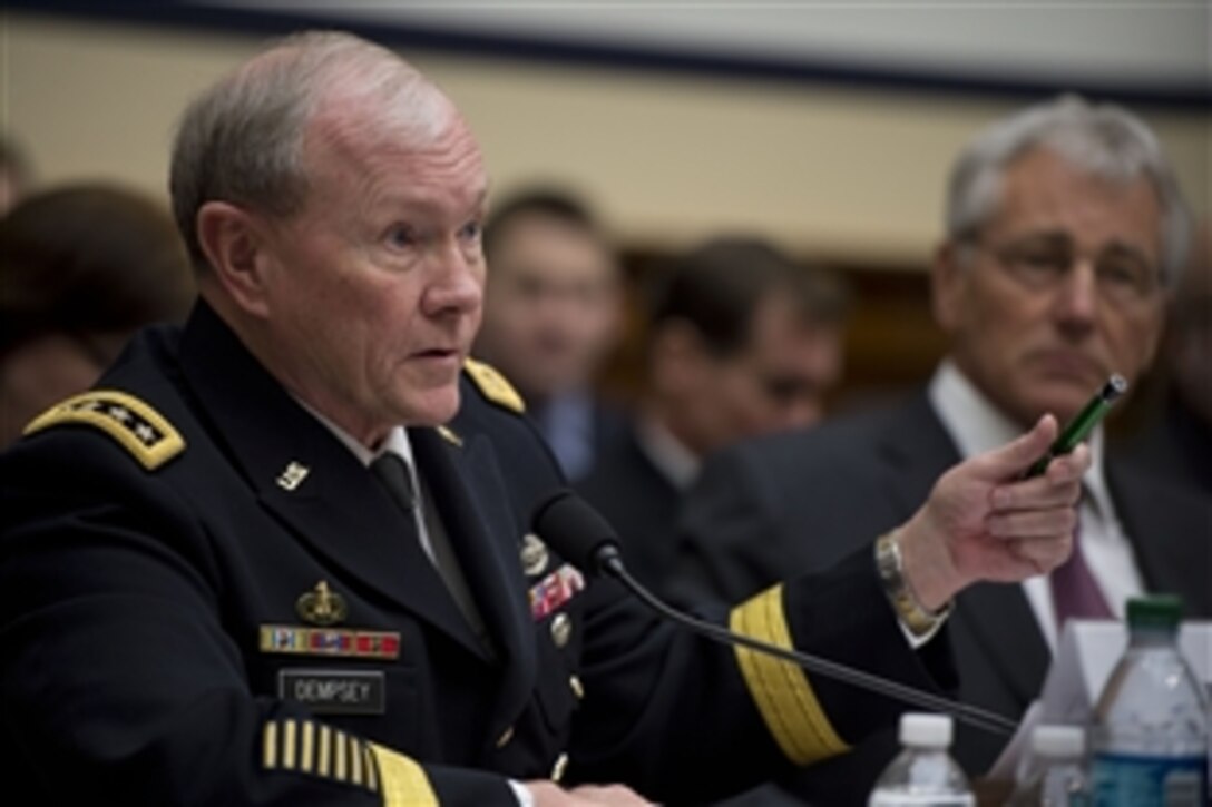 Army Gen. Martin E. Dempsey, chairman of the Joint Chiefs of Staff, testifies on the Defense Department's fiscal year 2015 budget request as Defense Secretary Chuck Hagel looks on before the House Armed Service Committee in Washington, D.C. on March 6, 2014.