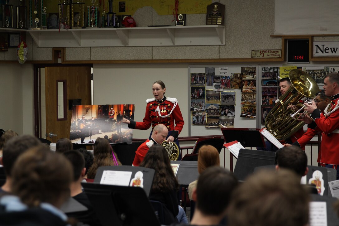 On March 6, 2004, a brass quintet made up of trumpet players Master Sgt. Michael Mergen and Staff Sgt. James McClarty, French horn player Staff Sgt. Cecilia Kozlowski, trombonist Staff Sgt. Christopher Reaves, and tubist Gunnery Sgt. Paul Mergen, performed a Music in the High Schools program at George Mason High School in Falls Church, Va. (U.S. Marine Corps photo by Master Sgt. Kristin duBois/released)