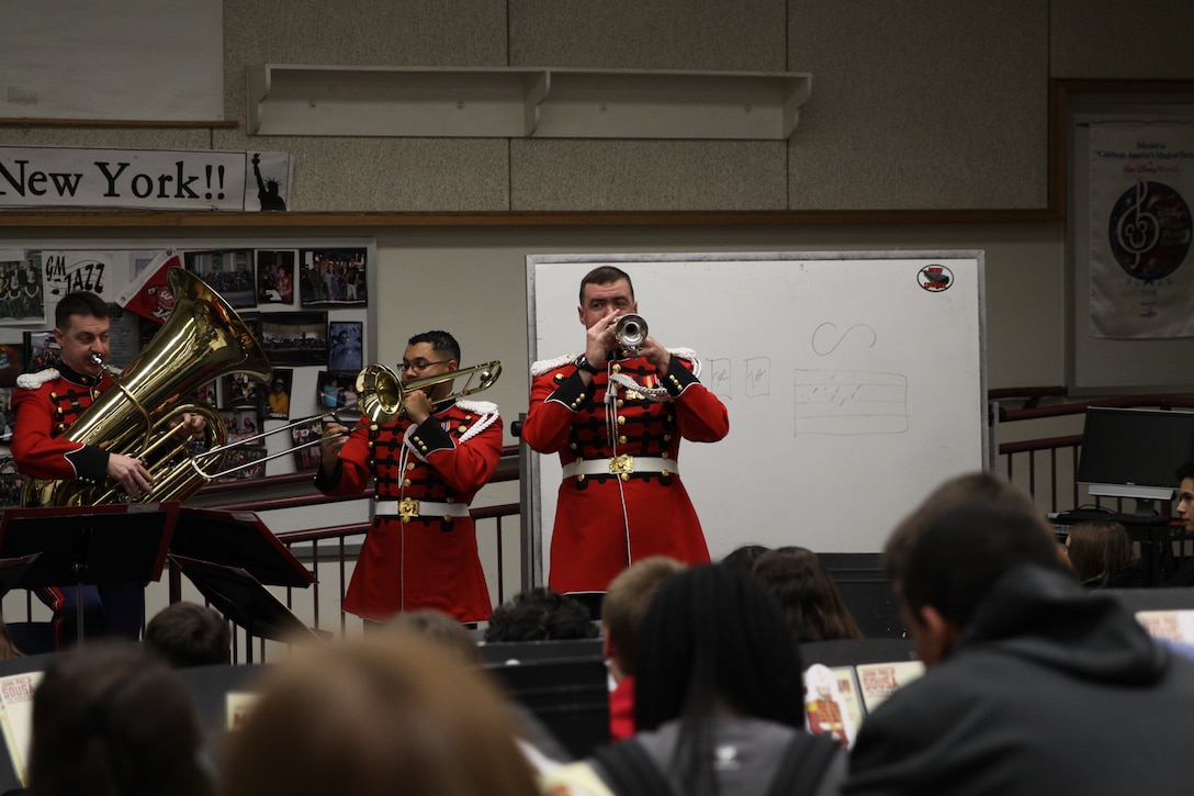 On March 6, 2004, a brass quintet made up of trumpet players Master Sgt. Michael Mergen and Staff Sgt. James McClarty, French horn player Staff Sgt. Cecilia Kozlowski, trombonist Staff Sgt. Christopher Reaves, and tubist Gunnery Sgt. Paul Mergen, performed a Music in the High Schools program at George Mason High School in Falls Church, Va. (U.S. Marine Corps photo by Master Sgt. Kristin duBois/released)
