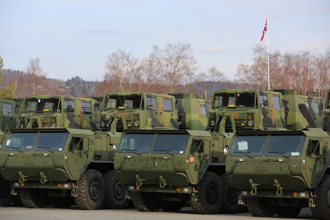 Norwegian Bandvagn 206s loaded onto U.S. Marine Logistics Vehicle System Replacements await shipment to staging areas for Cold Response 2014 at Vaernes Garrison, Norway, March 1, 2014. The consolidation of forces gave service members from both nations an experience from which Marines and soldiers at every level could learn. Cold Response 2014 is a Norwegian-led multinational exercise above the Arctic Circle designed prepare for crisis-response operations. 