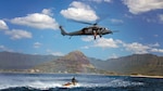 An Alaska Air National Guard HH-60 Pave Hawk hovers over the Pacific Ocean five miles off the coast of Oahu, Hawaii during a search and rescue exercise mission as part of the Alaska Air National Guard's Lava Rescue 2014 exercise the last two weeks of February.