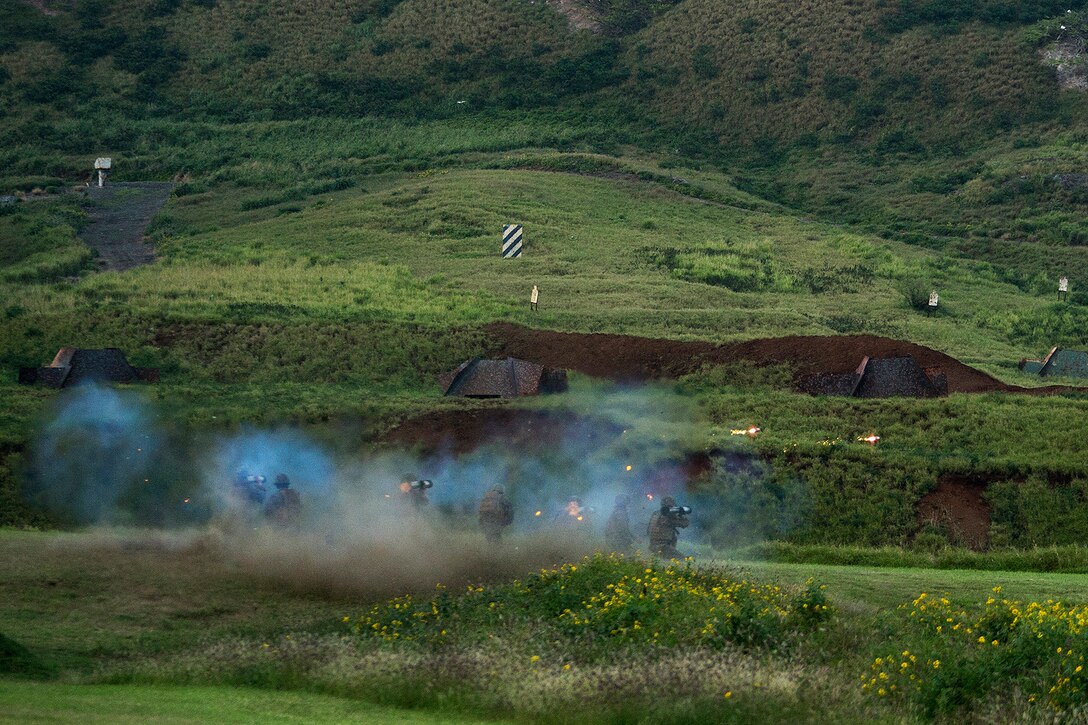 Four Marines with second platoon, Bravo Company, 3rd Reconnaissance Battalion, 3rd Marine Division, based in Okinawa, Japan, fire four M136 AT-4 rocket launchers simultaneously at lead targets on the Kaneohe Bay Range Training Facility, March 4, 2014. The recon Marines fired multiple weapons systems as part of a weapons training package designed to increase the platoon’s proficiency with each system on the battlefield. (U.S. Marine Corps photo by Lance Cpl. Matthew Bragg)