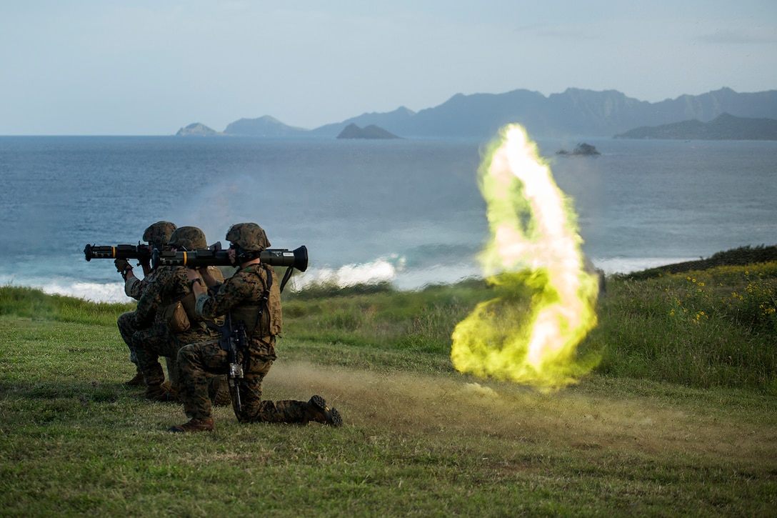 Sgt. Scott Hulsizer (left), a team leader with second platoon, Bravo Company, 3rd Reconnaissance Battalion, 3rd Marine Division, based in Okinawa, Japan, fires an M136 AT-4 rocket launcher after breaking away from the firing line as part of a weapons training package on the Kaneohe Bay Range Training Facility, March 4, 2014. 3rd Recon Bn. fired multiple weapon systems, such as the .50 caliber M2 Browning heavy machine gun, MK-19 automatic grenade launcher and M136 AT-4 rocket launchers, as part of a two day weapons package for Exercise Sandfisher. The weapons package focused on increasing the platoon’s proficiency with each system on the battlefield. (U.S. Marine Corps photo by Lance Cpl. Matthew Bragg)