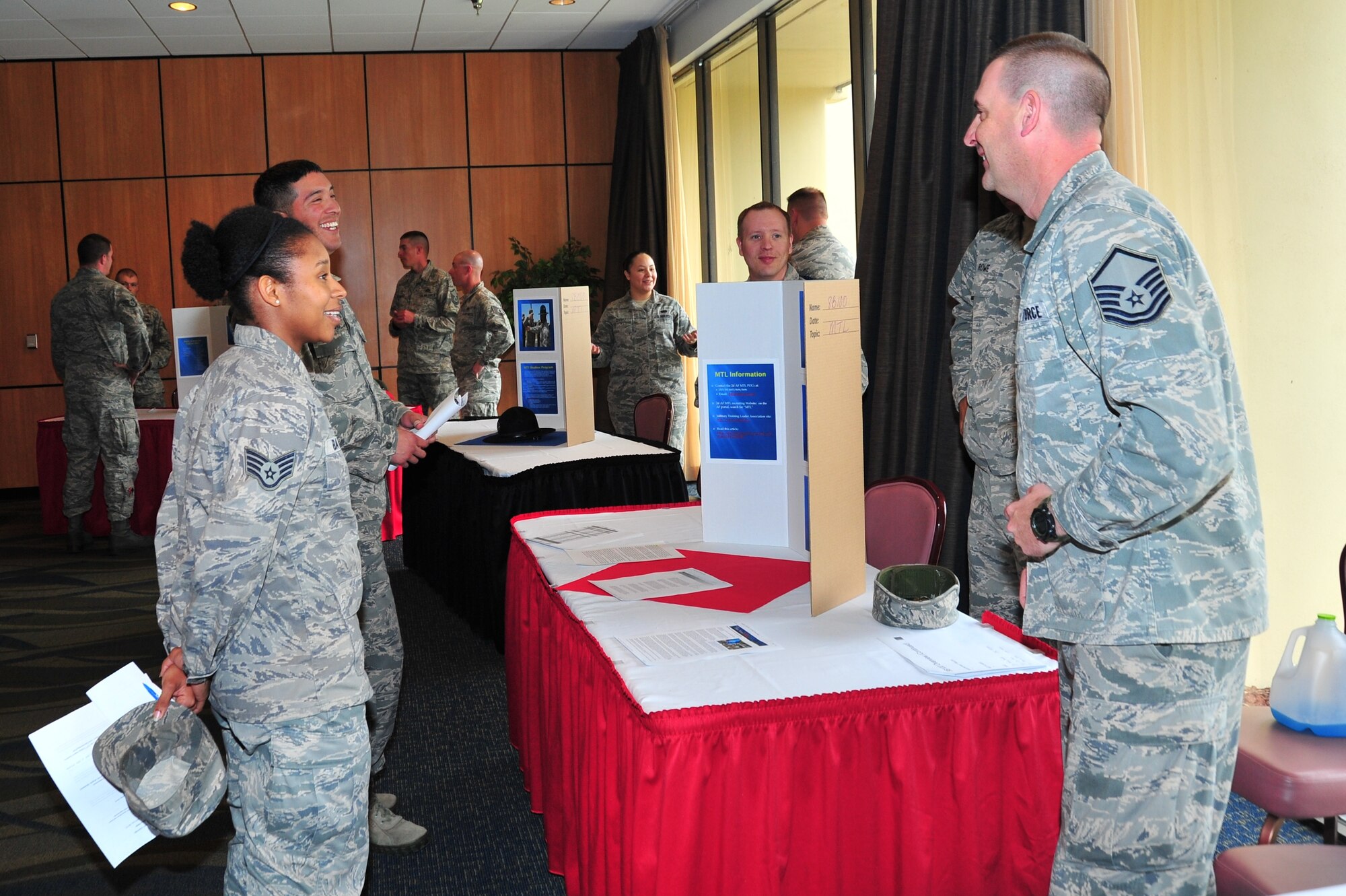 Team Tyndall Airmen visit booths at the Developmental Special Duty Job Fair March 7 at the Horizons Community Center. (U.S. Air Force photo by Staff Sgt. Rachelle Blake)