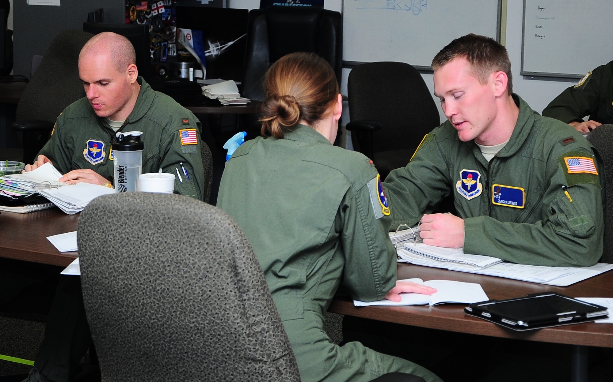 Students in the 41st Flying Training Squadron discuss advanced avionics and techniques in class at Columbus Air Force Base, Miss., March 6, 2014. The 41st FTS has six flights total; two flights are paired together to make a class. (U.S. Air Force photo/ Senior Airman Kaleb Snay)