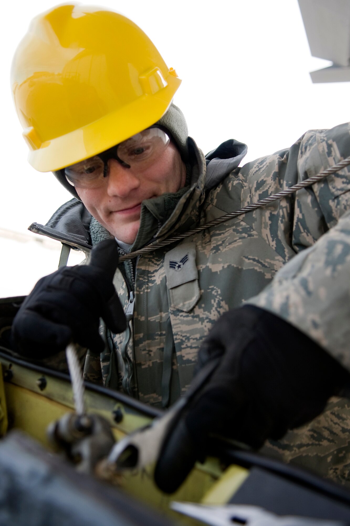 Senior Airman Joshua Christian, 434th Aircraft Maintenance Squadron aircraft hydraulic systems specialist, works to remove a cable from KC-135R Stratotanker boom at Grissom Air Reserve Base, Ind., Feb. 24, 2014. Christian and his fellow 434th AMXS Airmen worked to replace the boom after an unidentified noise was discovered. (U.S. Air Force photo/Tech. Sgt. Mark R. W. Orders-Woempner)
