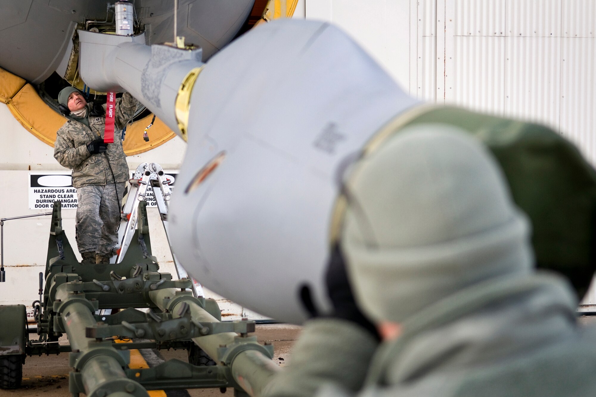 Tech. Sgt. Randy Brooks, 434th Aircraft Maintenance Squadron aircraft pneudraulic technician, left, and Senior Airman Robert Kirleis, 434th AMXS aircraft hydraulic systems specialist, work to remove a boom from a KC-135R Stratotanker at Grissom Air Reserve Base, Ind., Feb. 24, 2014. The boom needed to be removed for repair after an unidentified noise was discovered. (U.S. Air Force photo/Tech. Sgt. Mark R. W. Orders-Woempner)
