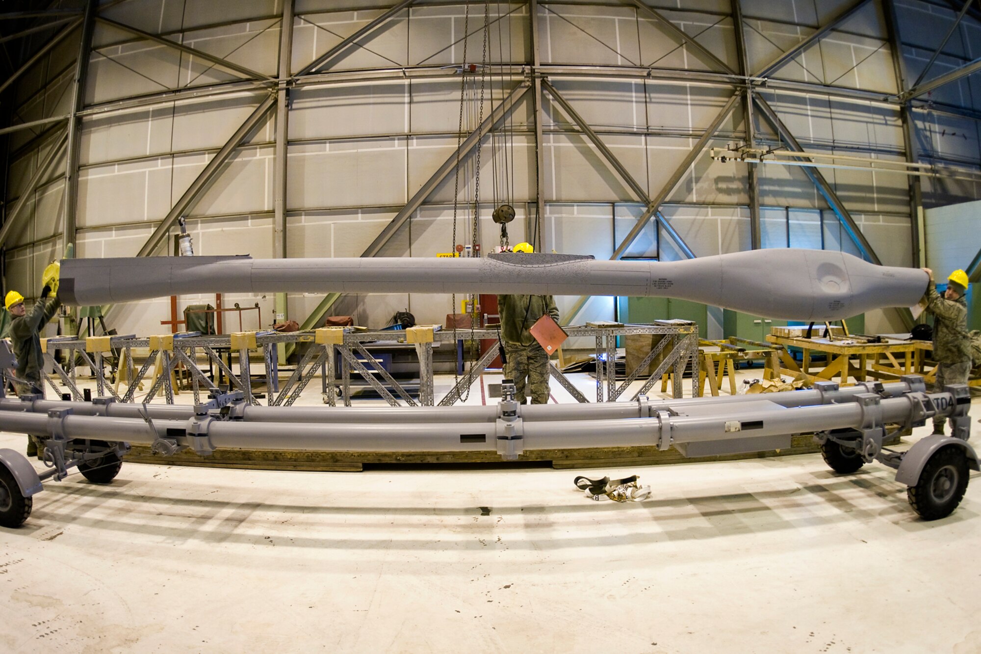 Airmen from the 434th Aircraft Maintenance Squadron remove a new KC-135R Stratotanker boom from its crate and load it onto a cart at Grissom Air Reserve Base, Ind., Feb. 24, 2014. The new boom was installed on one of Grissom's KC-135s shortly after. (U.S. Air Force photo/Tech. Sgt. Mark R. W. Orders-Woempner)
