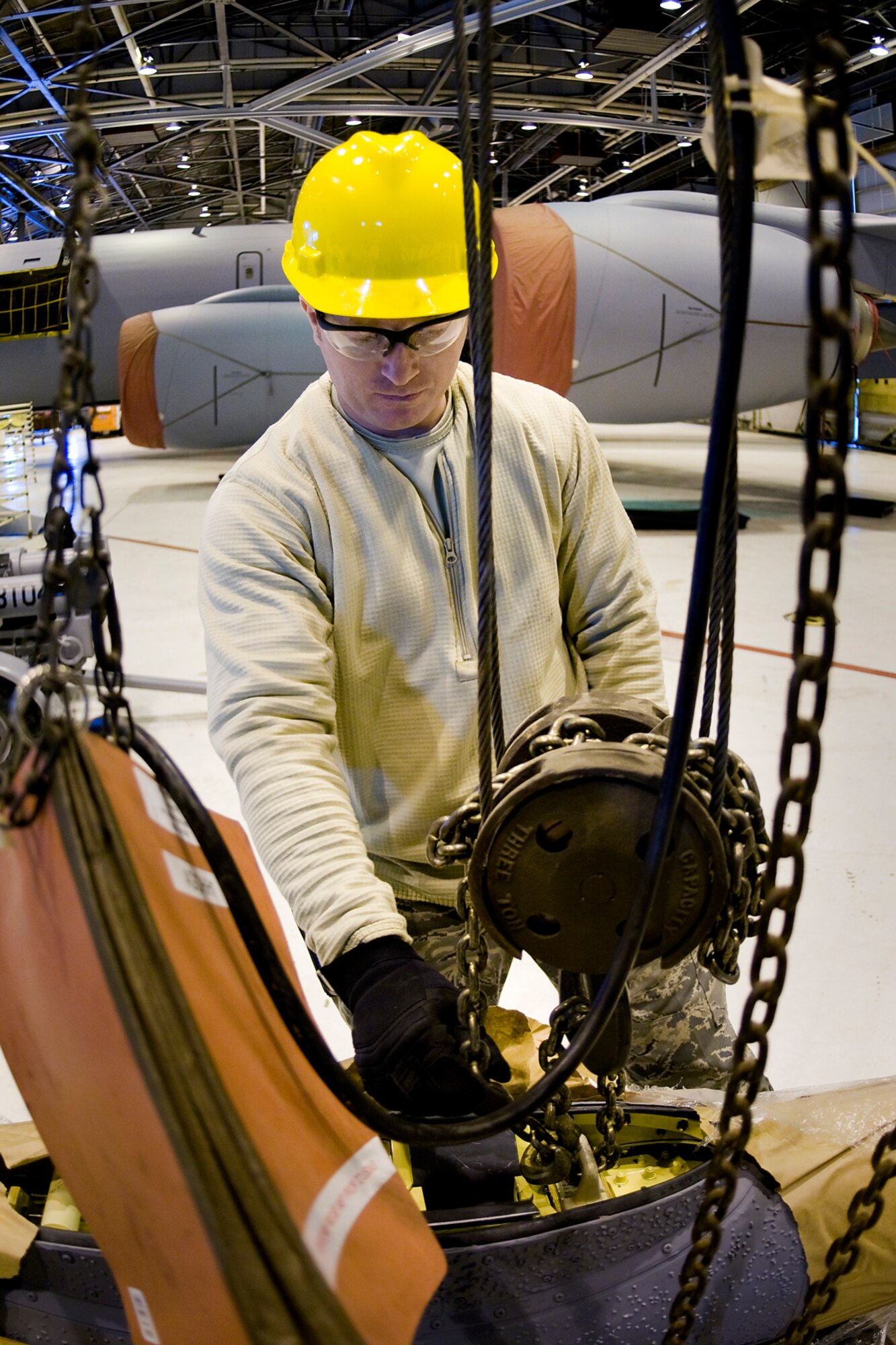Senior Airman Robert Kirleis, 434th Aircraft Maintenance Squadron aircraft hydraulic systems specialist, works to remove a new KC-135R Stratotanker boom from its crate at Grissom Air Reserve Base, Ind., Feb. 24, 2014. The new boom was installed on one of Grissom's KC-135s shortly after. (U.S. Air Force photo/Tech. Sgt. Mark R. W. Orders-Woempner)
