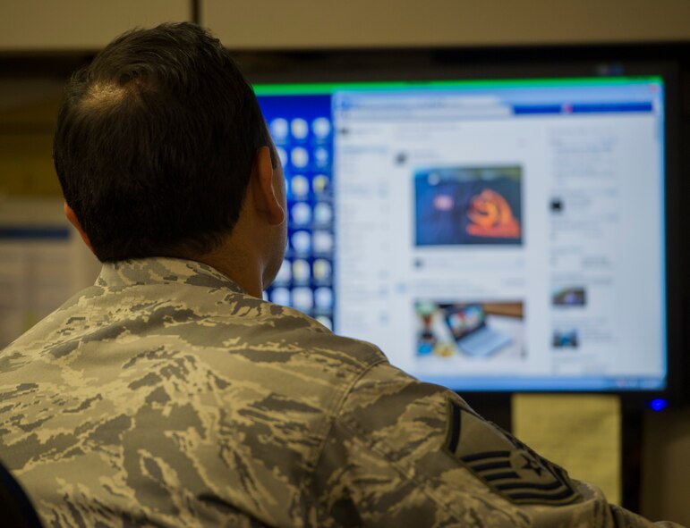A Public Affairs Airman reviews social media products as part of his daily duties, March 6, 2014, at Joint Base Pearl Harbor-Hickam, Hawaii. Servicemembers need to be aware that even though they are encouraged to use social media, they still need to follow the guidelines in AFI 1-1 when posting. Air Force standards must be observed at all times, both on and off-duty, regardless of the method of communication used. (U.S. Air Force photo/Staff Sgt. Nathaniel Allen)