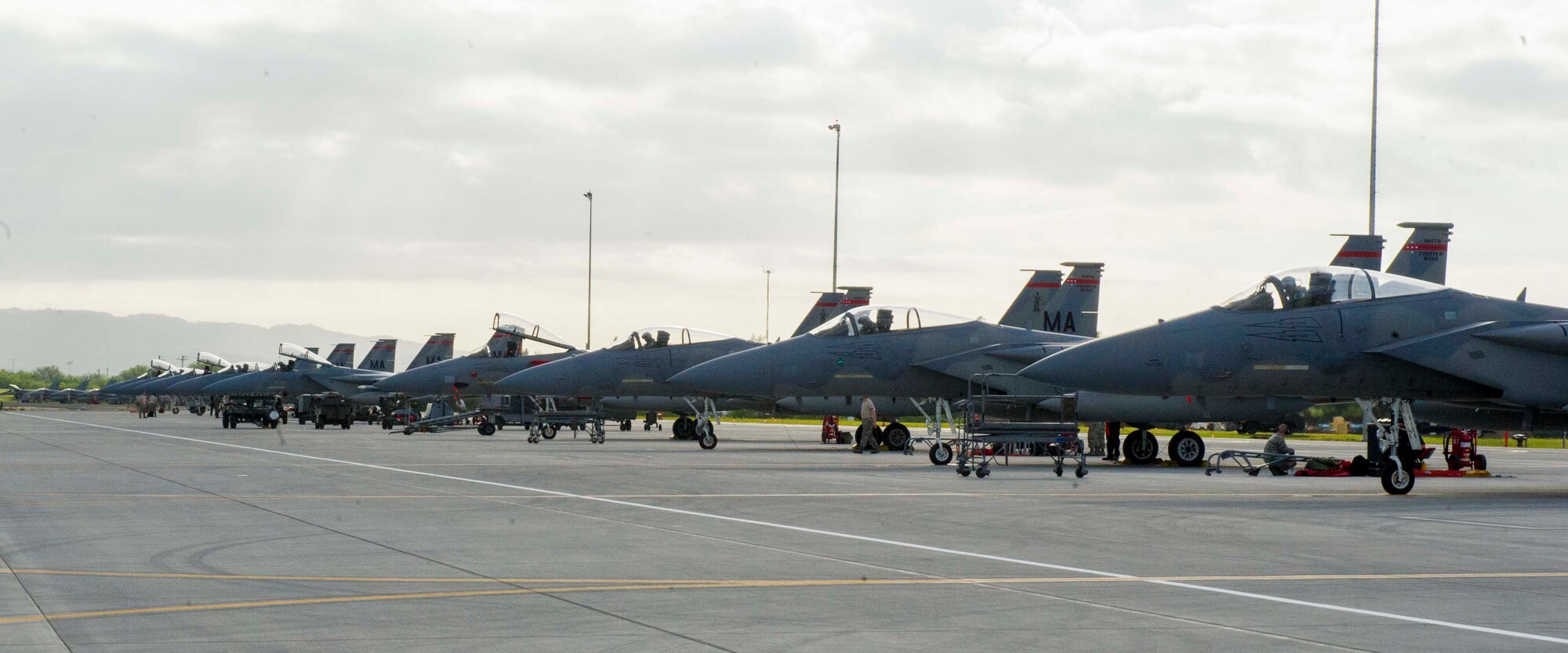 F-15 Eagles deployed from the 104th Fighter Wing, Massachusetts Air National Guard, sit on the flightline at Joint Base Pearl Harbor-Hickam, Hawaii, March 6, 2014. The F-15s are at JBPH-H as part of Sentry Aloha, an annual aerial combat exercise focused on offensive and defensive counter measures and fighter integration. (U.S. Air Force photo/Tech. Sgt Terri Paden)