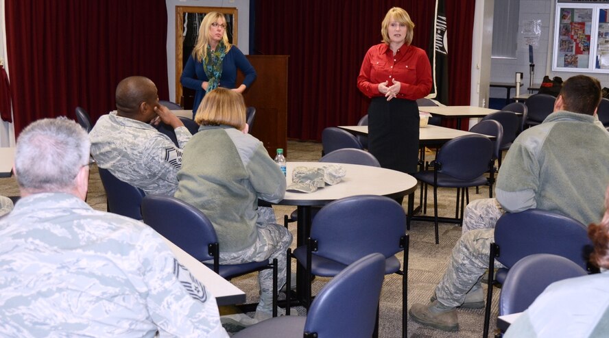 Rebecca Clarke, left, wife of Air National Guard Director Lt. Gen. Stanley E. Clarke, and Marie Hotaling, wife of Command Chief Master Sgt. of the Air National Guard speak to members of the Maryland Air National Guard during their visit to Warfiield Air National Guard Base March 7, 2014. The trip was a town hall meeting to identifying challenges facing Airmen and their families. (Air National Guard photo by Tech. Sgt. David Speicher/RELEASED)