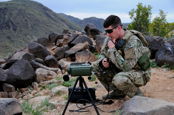 A picture of U.S. Air Force Tech. Sgt. Wayne White, a tactical air control party airman using a laser marker.