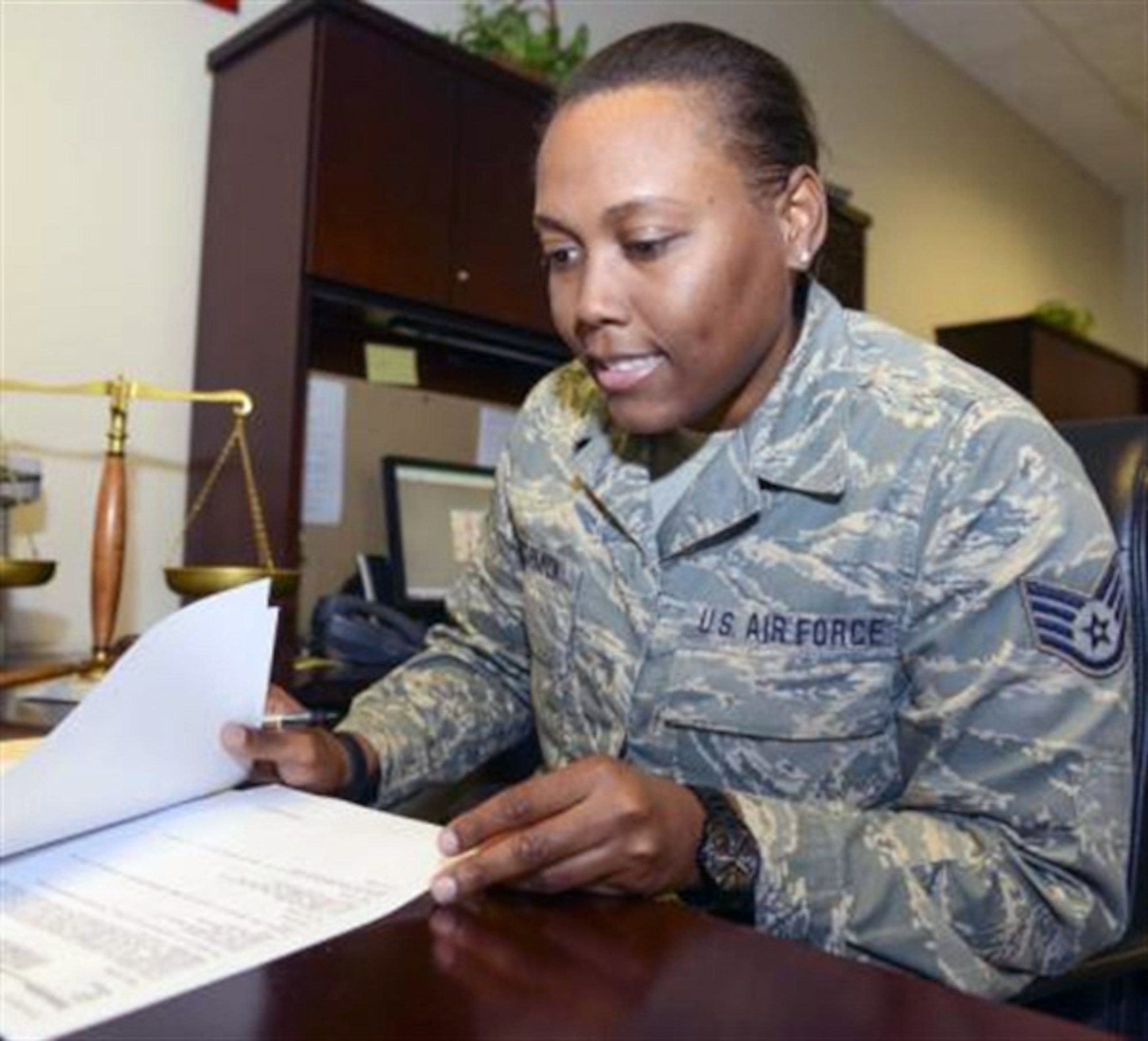 Air Force Staff Sgt. Barricia McCormick, a paralegal with the 116th Air Control Wing, reviews legal cases during a drill weekend at Robins Feb. 8. McCormick, who comes from a long line of family members who have served in the armed forces dating back to World War I, is related to Harriet Ross Tubman, the African American abolitionist and humanitarian responsible for the rescue of more than 300 slaves through the Underground Railroad. (Georgia Air National Guard photo by Air Force Master Sgt. Roger Parsons)
