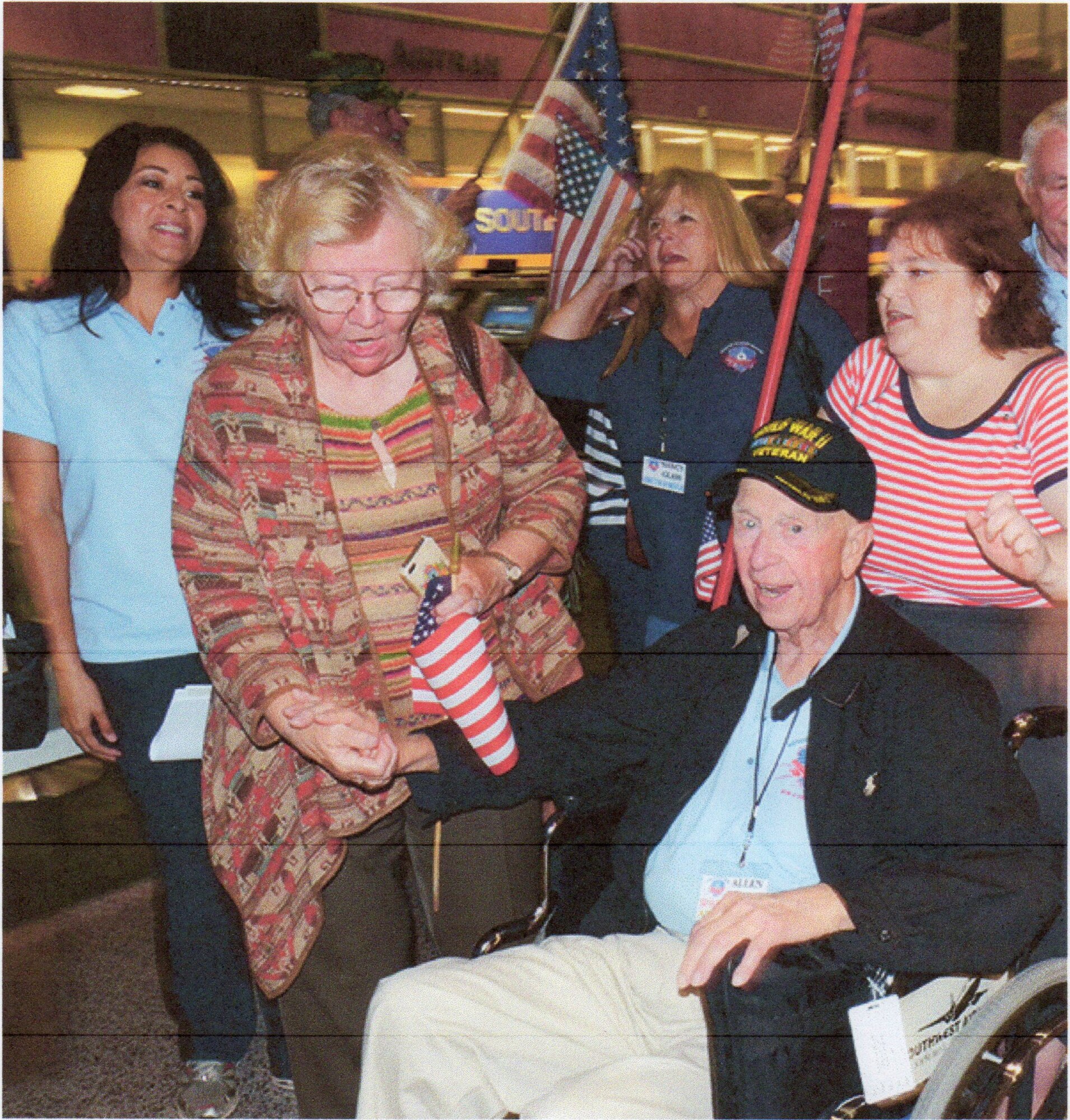 Allen Larsen arrives home at Austin Bergstrom International Airport, November 2, 2013, welcomed by his wife Margaret and other well-wishers.