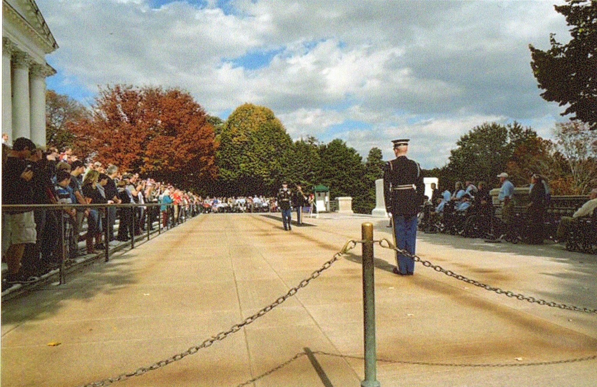 Members of the Austin Honor Flight (at right in shade), watch the changing of the guard ceremony at the Tomb of the Unknown Soldier, Arlington National Cemetery, November 2, 2013.