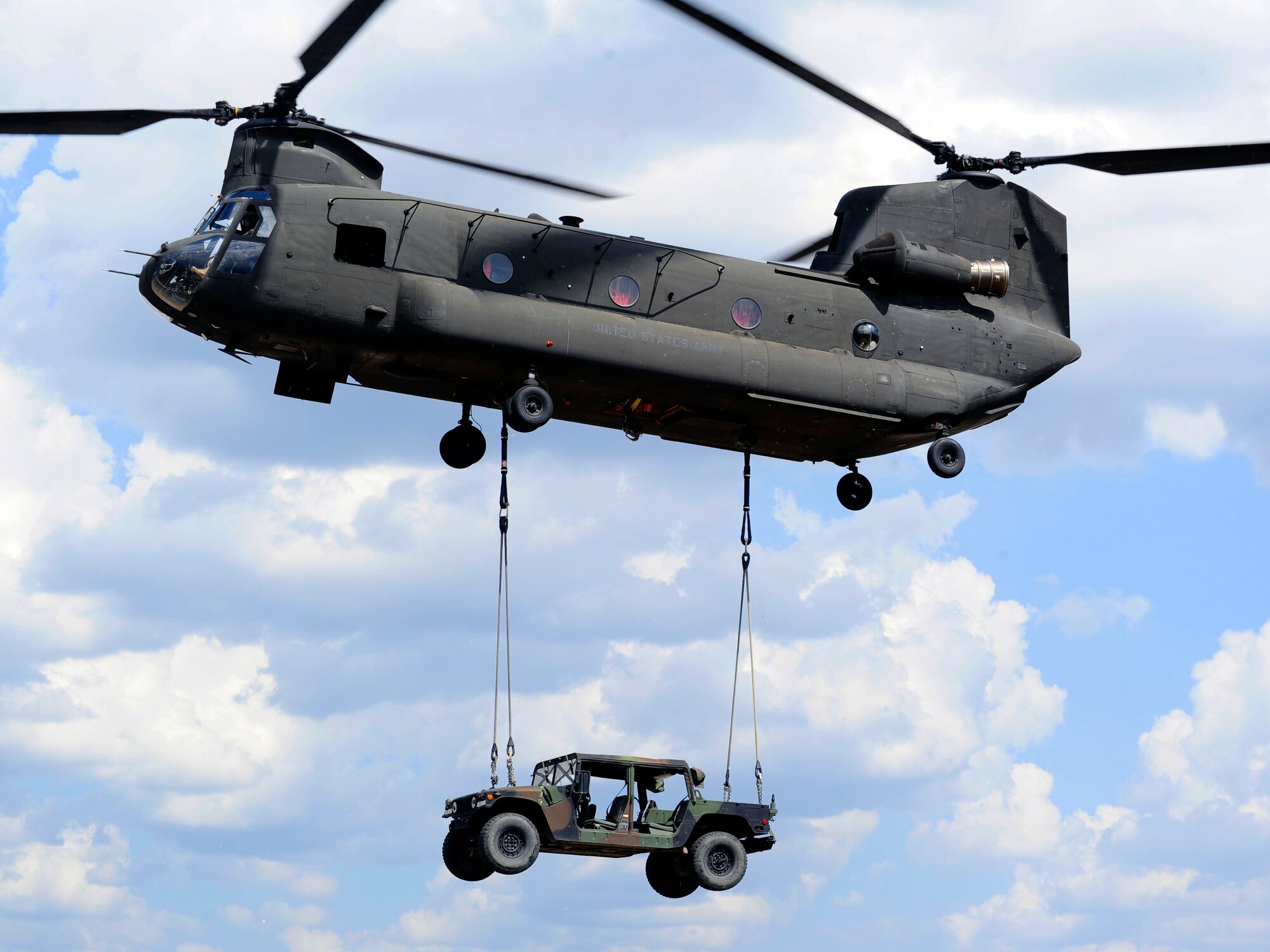 Members of Joint Task Force-Bravo conducted sling-load training at Soto Cano Air Base, Honduras, March 6, 2014. Sling-loading allows Task Force helicopters to transport extremely heavy loads, to include items such as vehicles, generators, and all types of cargo and supplies. (Photo by Martin Chahin) 