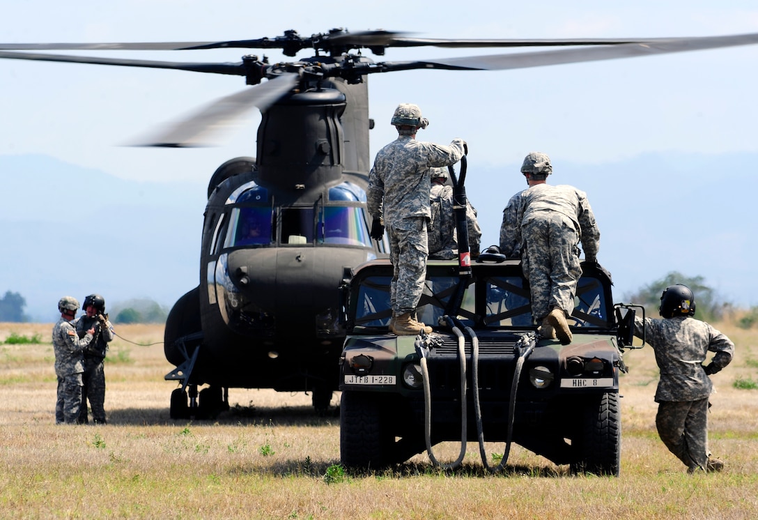 Members of Joint Task Force-Bravo conducted sling-load training at Soto Cano Air Base, Honduras, March 6, 2014. Sling-loading allows Task Force helicopters to transport extremely heavy loads, to include items such as vehicles, generators, and all types of cargo and supplies. (Photo by Martin Chahin) 