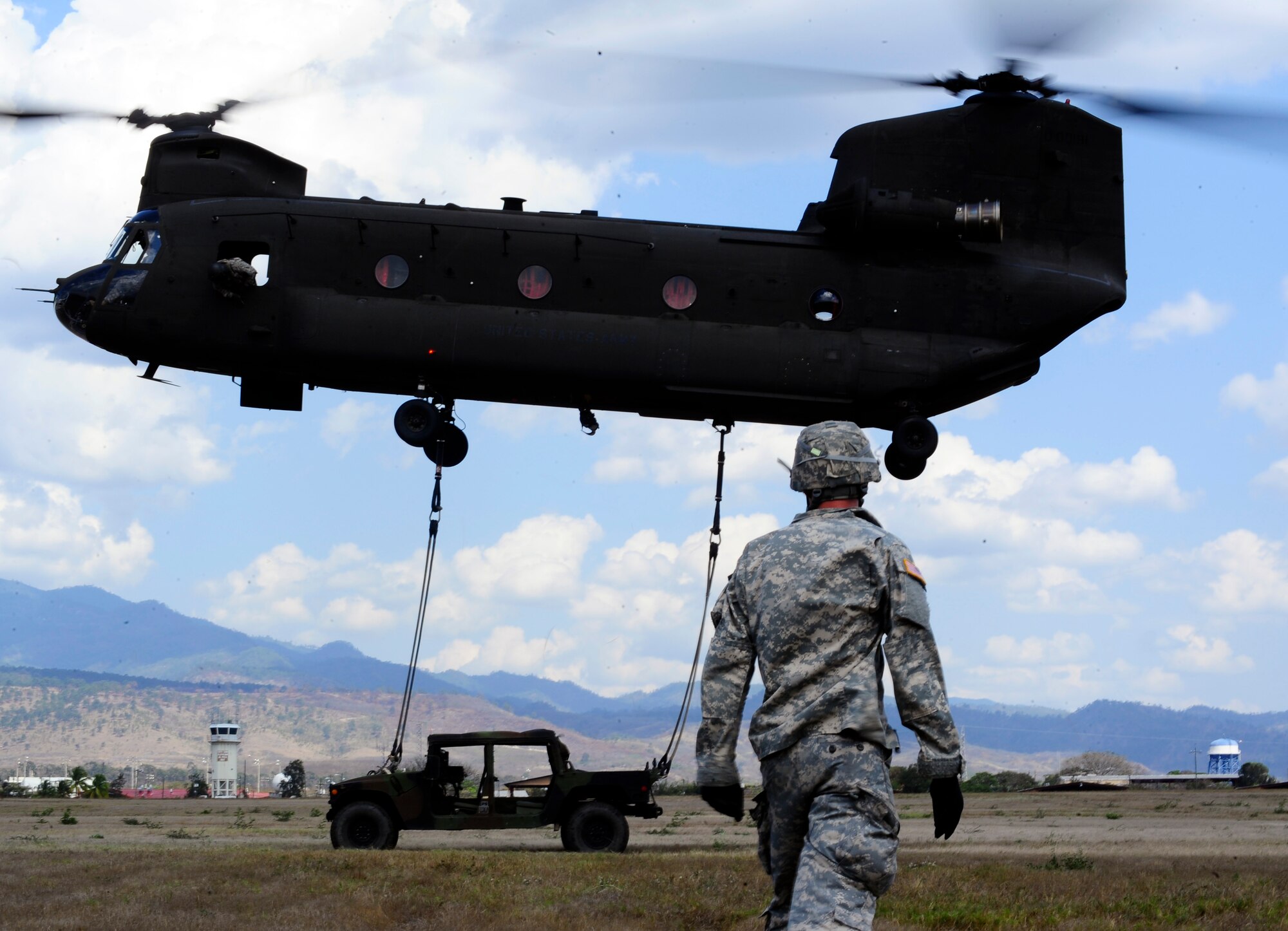 Members of Joint Task Force-Bravo conducted sling-load training at Soto Cano Air Base, Honduras, March 6, 2014. Sling-loading allows Task Force helicopters to transport extremely heavy loads, to include items such as vehicles, generators, and all types of cargo and supplies. (Photo by Martin Chahin) 