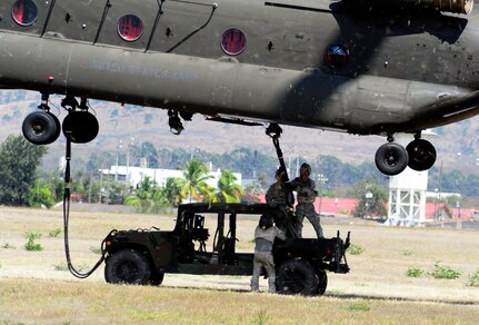 Members of Joint Task Force-Bravo conducted sling-load training at Soto Cano Air Base, Honduras, March 6, 2014. Sling-loading allows Task Force helicopters to transport extremely heavy loads, to include items such as vehicles, generators, and all types of cargo and supplies. (Photo by Martin Chahin) 