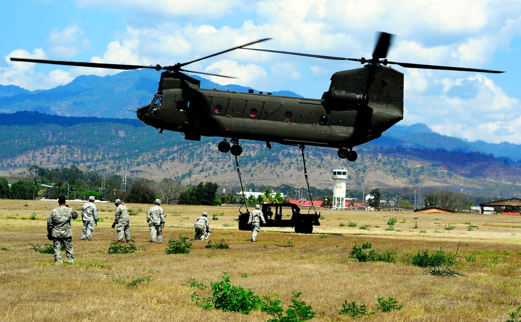 Members of Joint Task Force-Bravo conducted sling-load training at Soto Cano Air Base, Honduras, March 6, 2014. Sling-loading allows Task Force helicopters to transport extremely heavy loads, to include items such as vehicles, generators, and all types of cargo and supplies. (Photo by Martin Chahin) 