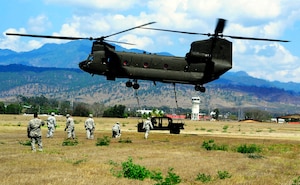 Members of Joint Task Force-Bravo conducted sling-load training at Soto Cano Air Base, Honduras, March 6, 2014. Sling-loading allows Task Force helicopters to transport extremely heavy loads, to include items such as vehicles, generators, and all types of cargo and supplies. (Photo by Martin Chahin) 
