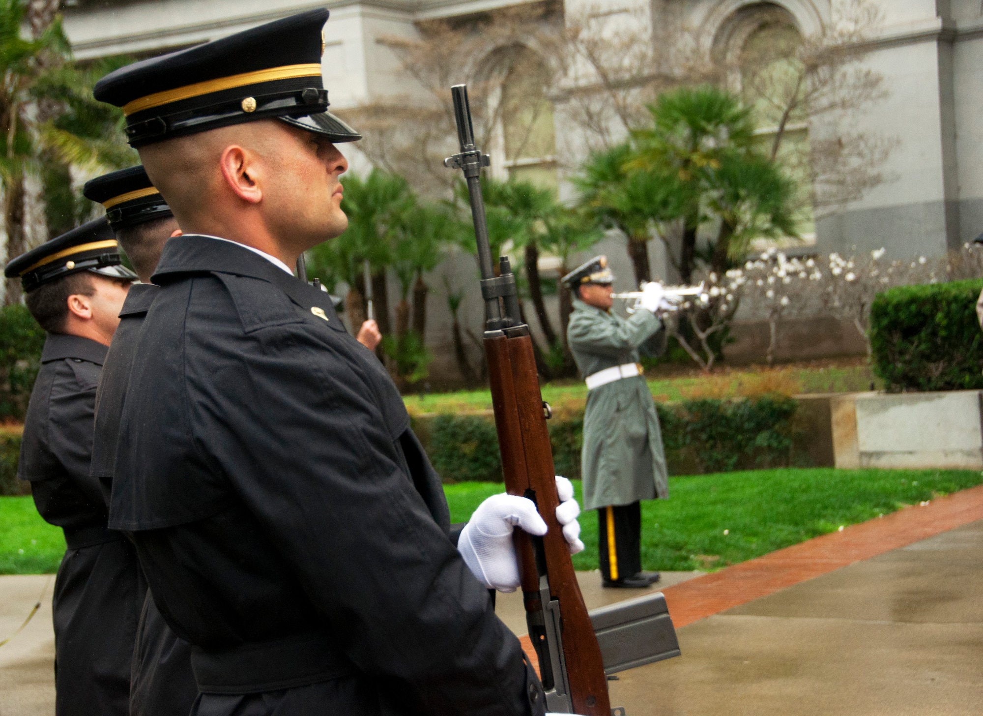 The California National Guard renders a rifle salute and the playing of Taps at the conclusion of the opening ceremony for The Wall That Heals Feb. 27 in Sacramento, Calif. The Wall That Heals is a replica of the Vietnam Memorial Wall in Washington D.C. that travels from state to state. (U.S. Air Force photo/Senior Airman Madelyn Brown)