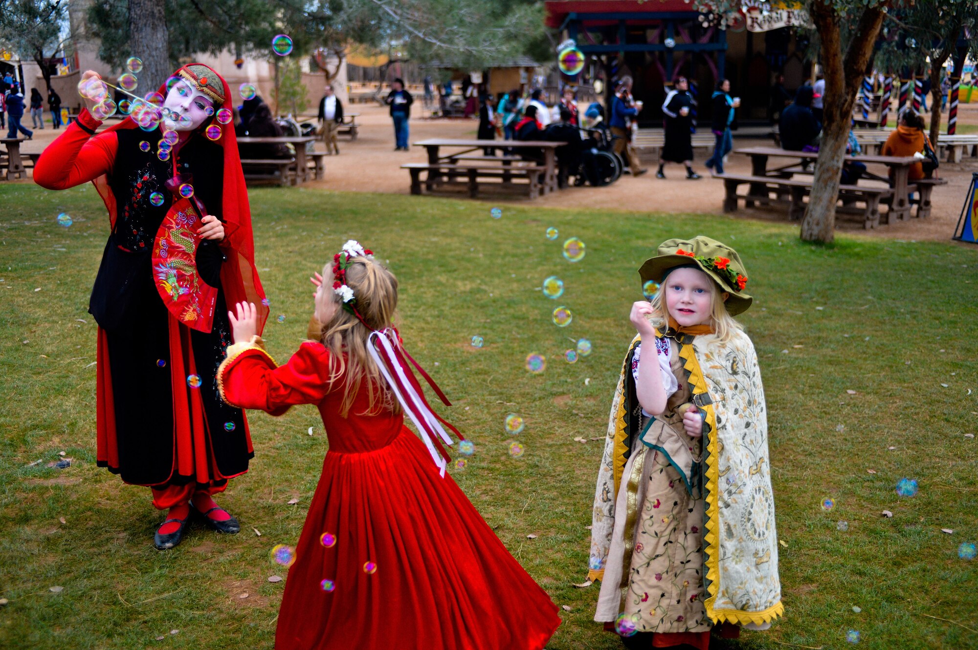A festival denizen entertains children with bubbles at the Arizona Renaissance Festival in Apache Junction, Mar 9, 2013. This year’s festival is located seven miles east of Apache Junction on US Highway 60 and will be open Saturdays, Sundays and on President’s Day from February 8 to March 30, 10:00 a.m. to 6:00 p.m., rain or shine. (U.S. Air Force photo/Senior Airman Jason Colbert)
