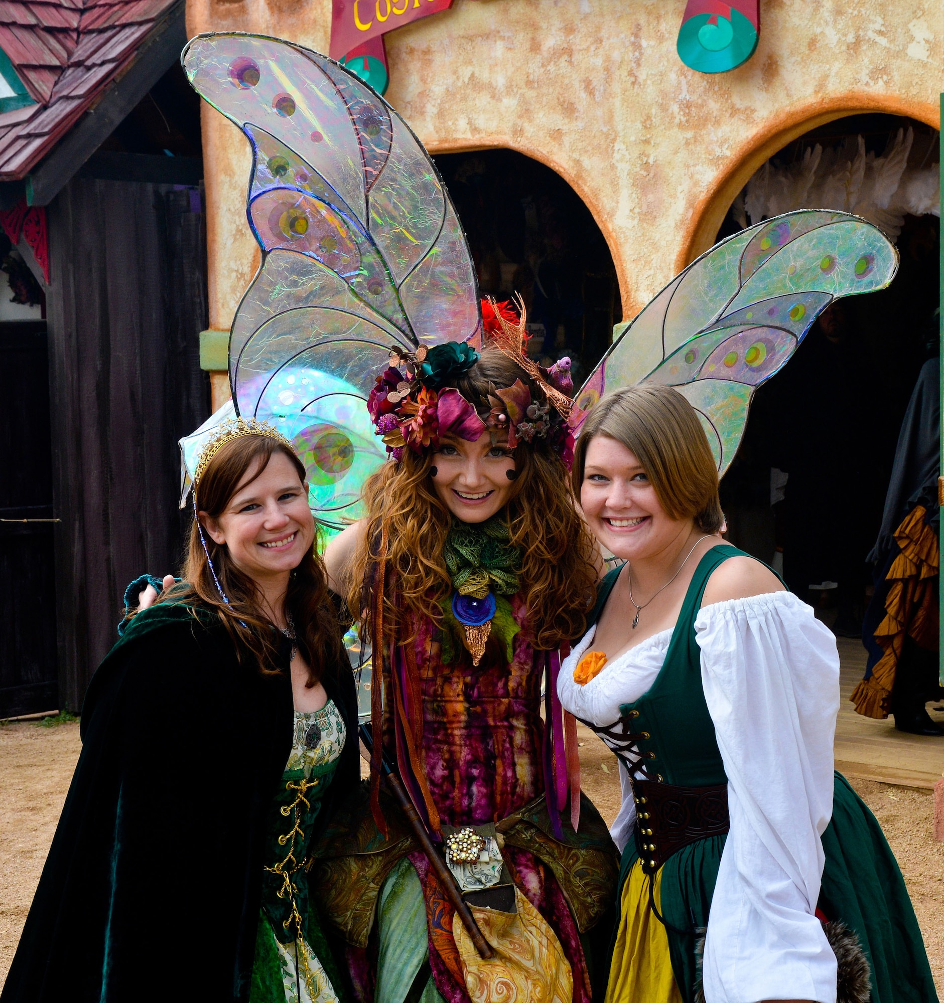 Tech. Sgt. Laurie Snyder (left), 56th Fighter Wing command post security manager, and Carissa Latham (right), wife of Senior Airman Jeffrey Latham II, 607th Air Control Squadron radio frequency transmission journeyman, poses with Twig the Fairy at the Arizona Renaissance Festival in Apache Junction, Mar 9, 2013. (U.S. Air Force photo/Senior Airman Jason Colbert)