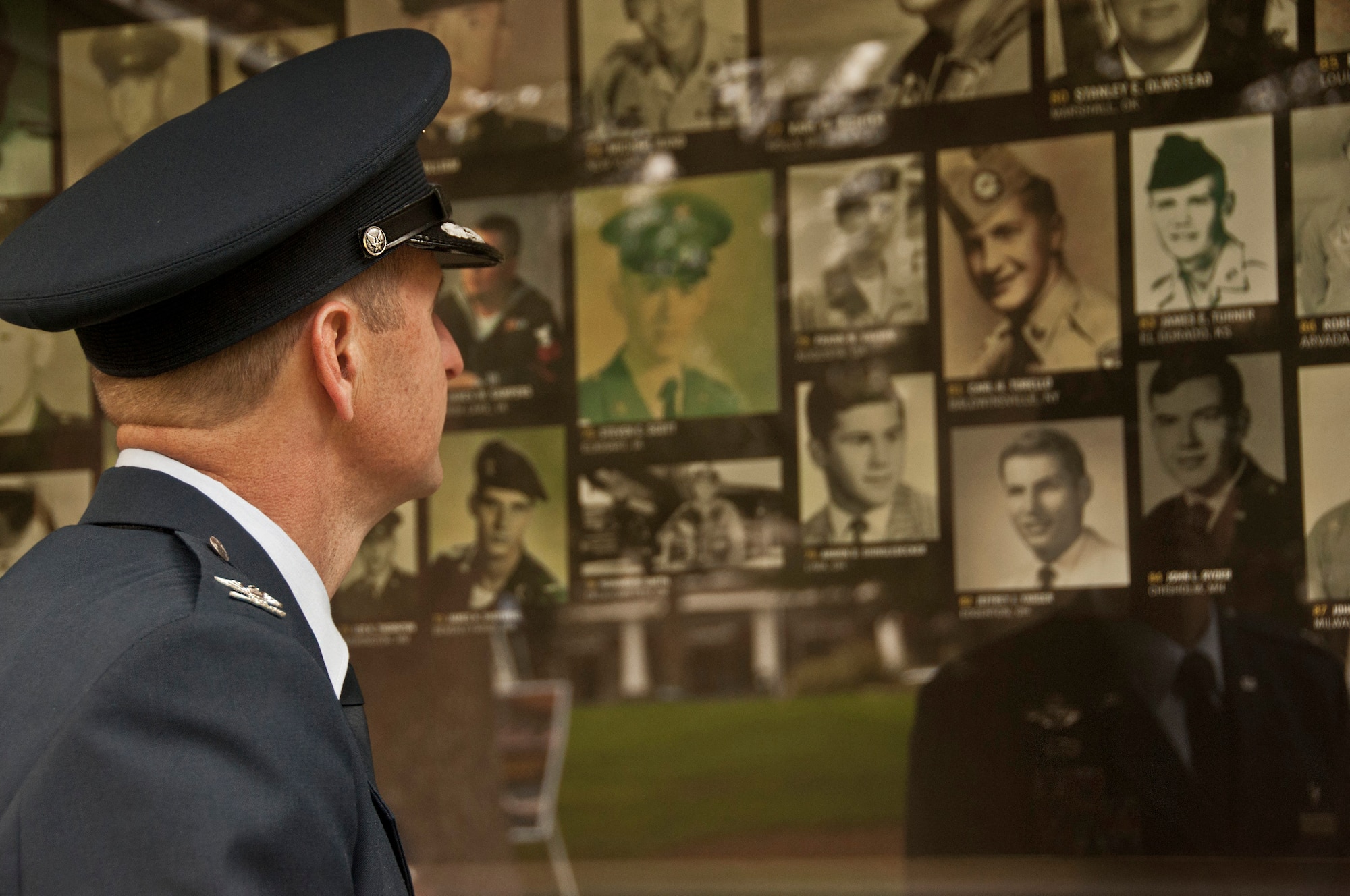 Col. Corey Martin, 60th Air Mobility Wing commander, visits the mobile museum Feb. 24 after The Wall That Heals opening ceremony in Sacramento, Calif. The mobile museum accompanies the Vietnam Memorial Wall replica from state to state and contains pictures, information and artifacts from servicemembers in the Vietnam conflict. (U.S. Air Force photo/Senior Airman Madelyn Brown)