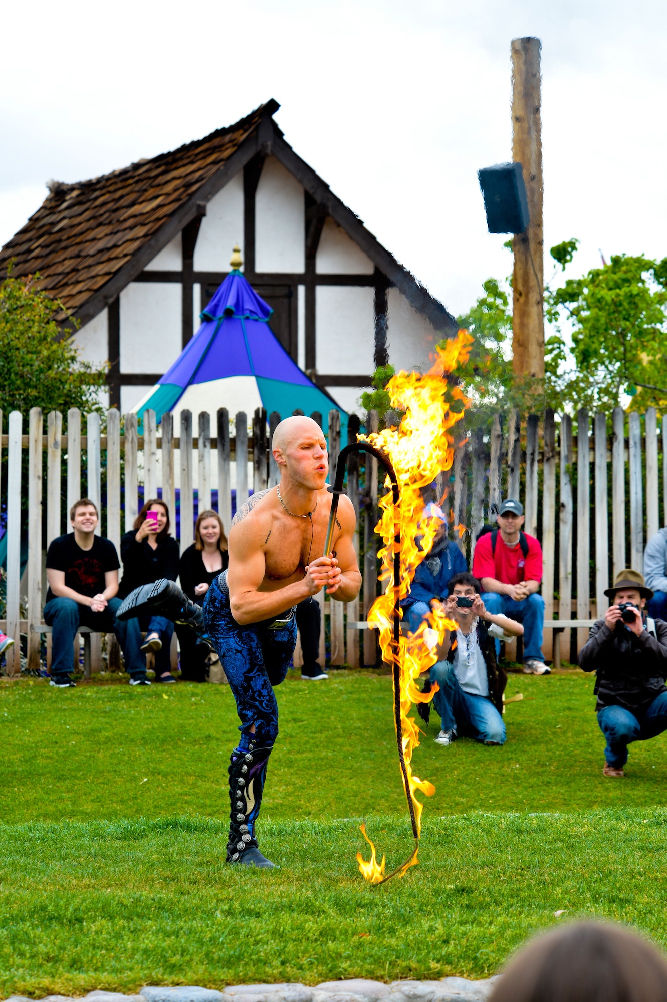 Adam “Crack” Winrich blows on his fire whip during the Adam Crack whip show at the Arizona Renaissance Festival in Apache Junction. Winrich holds nine Guinness world records to include the longest whip ever cracked (216 feet long) and the most two-handed whip cracks in a minute (420). (U.S. Air Force photo/Senior Airman Jason Colbert)