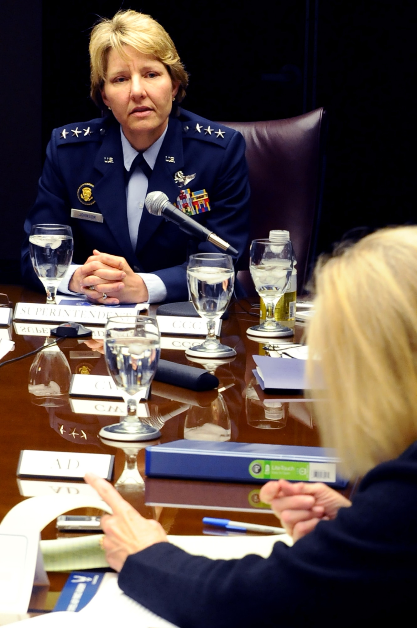Academy Superintendent Lt. Gen. Michelle D. Johnson takes questions from Pam Zubek, a reporter with the Colorado Springs Independent, March 3, during a meeting with media representatives from Colorado Springs and Air Force Times. The general made public the Academy's fiscal year 2015 budget impact March 4. (Master Sgt. Kenneth Bellard/Air Force photo) 