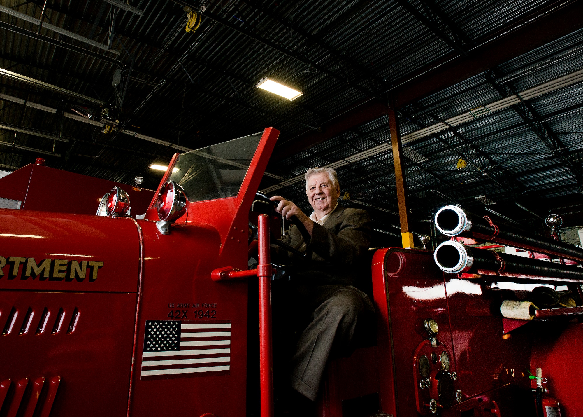 Ninety-three-year-old retired Fire Chief Robert Dittmer spent March 3 revisiting Travis, where he toured the base, spent time with the new Airmen fire fighters and sat in the model fire truck he used to operate, Seagraves. (U.S. Air Force photo/T.C. Perkins Jr.)
