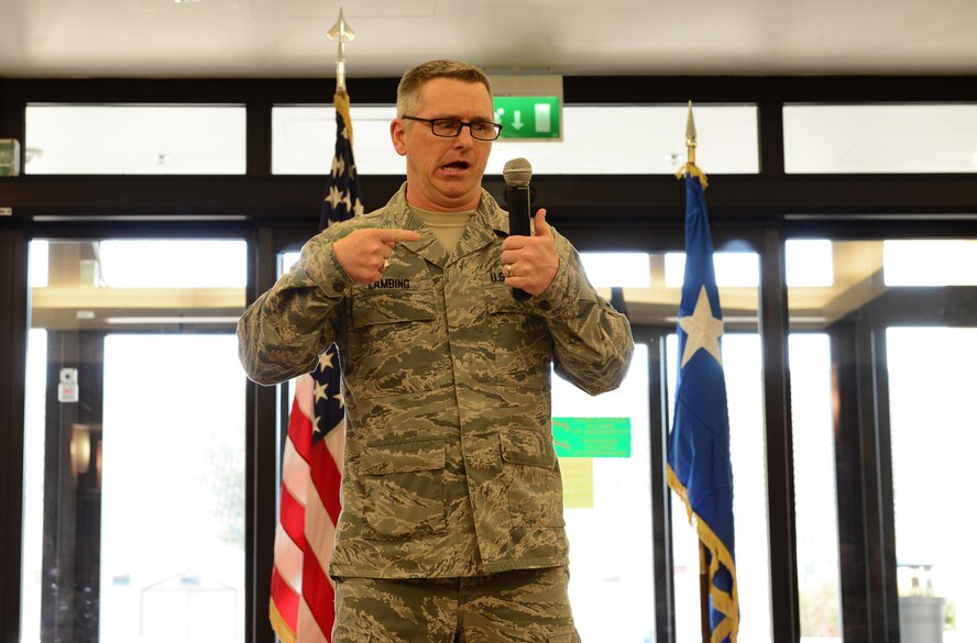 Chief Master Sgt. Kevin Lambing, U.S Air Force medical enlisted force and enlisted corps chief, jokes with Airmen from the 31st Medical Group, March 7, 2014, at Aviano Air Base, Italy. Lt. Gen. (Dr.) Thomas Travis, Surgeon General of the U.S. Air Force, and Lambing spoke to the 31st MDG Airmen and answered questions about budget restraints, improving healthcare and force management concerns. (U.S. Air Force Photo/Senior Airman Matthew Lotz)