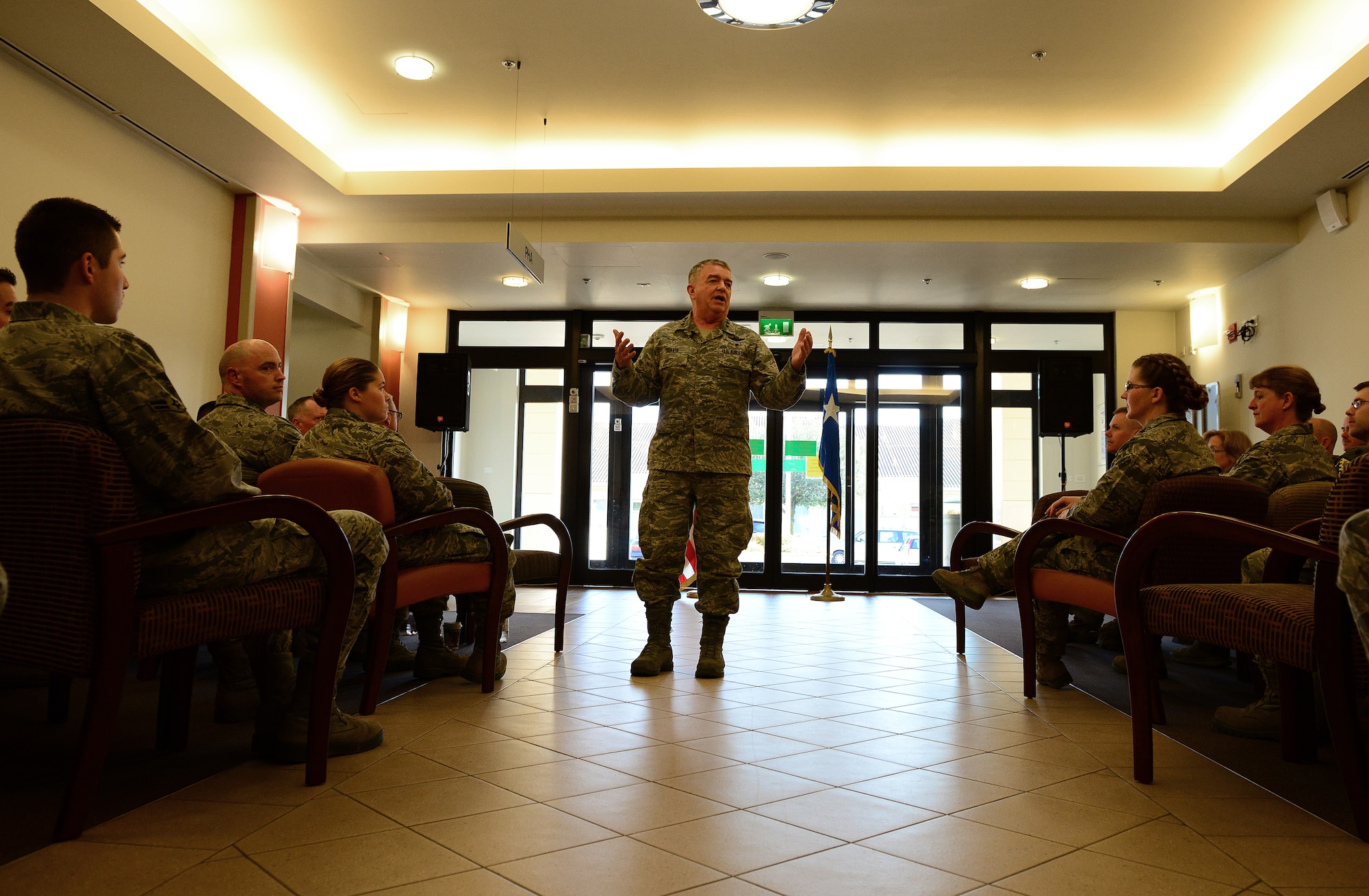 Lt. Gen. (Dr.) Thomas Travis, Surgeon General of the U.S. Air Force, speaks to 31st Medical Group Airmen, March 7, 2014, at Aviano Air Base, Italy. After a tour of the hospital, Travis spoke to the Airmen and answered questions about budget restraints, improving healthcare and force management concerns. (U.S. Air Force Photo/Senior Airman Matthew Lotz)