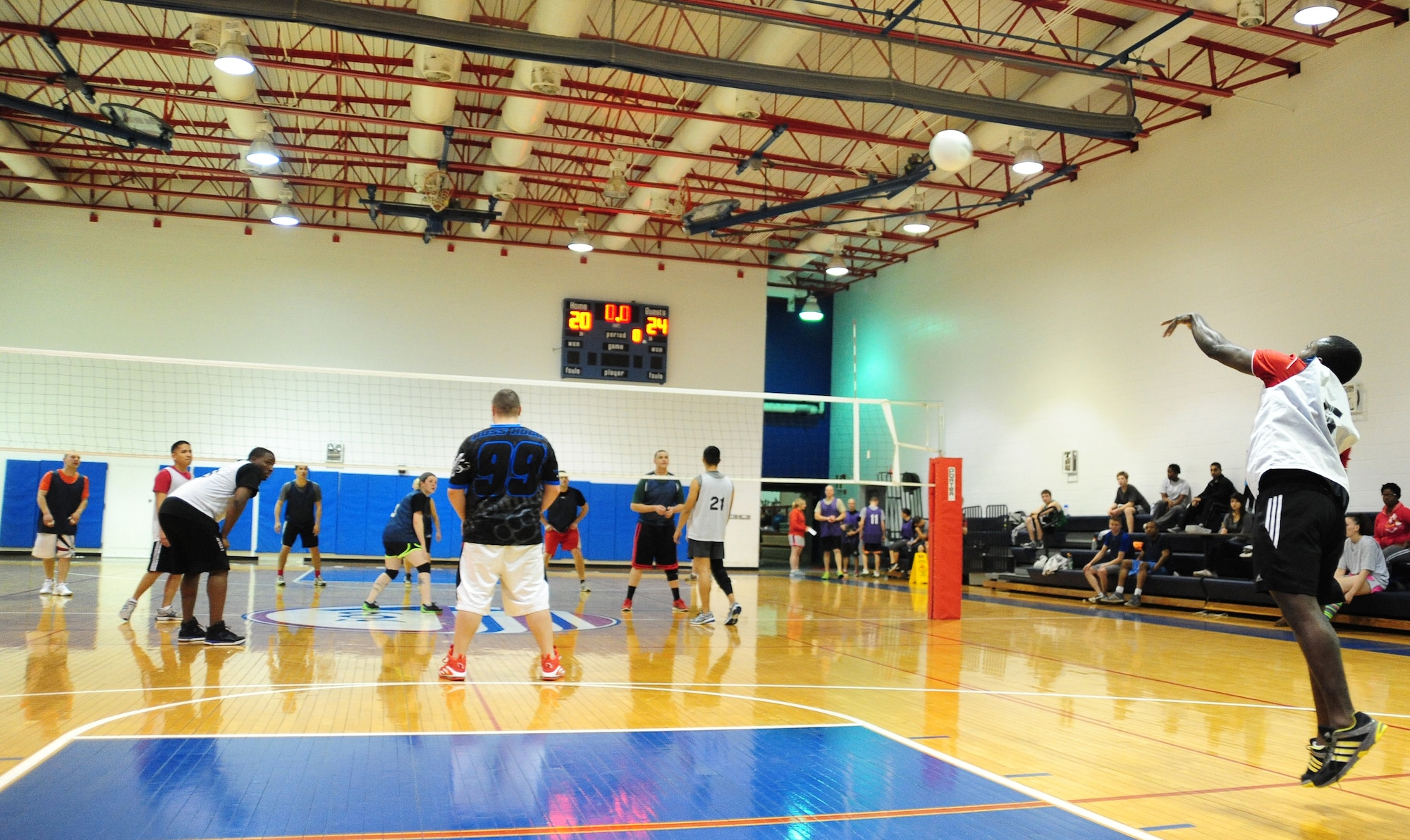 Duzaghie Tafie, 509th Force Support Squadron intramural volleyball team, serves the ball during the second half of a volleyball game against the 709th Munitions Support Squadron at the Fitness Center of Whiteman Air Force Base, Mo., Feb. 18, 2014. Team Whiteman’s intramural volleyball season began Feb. 10, and is scheduled to end March 18. Playoffs begin March 24. (U.S. Air Force photo by Staff Sgt. Nick Wilson)