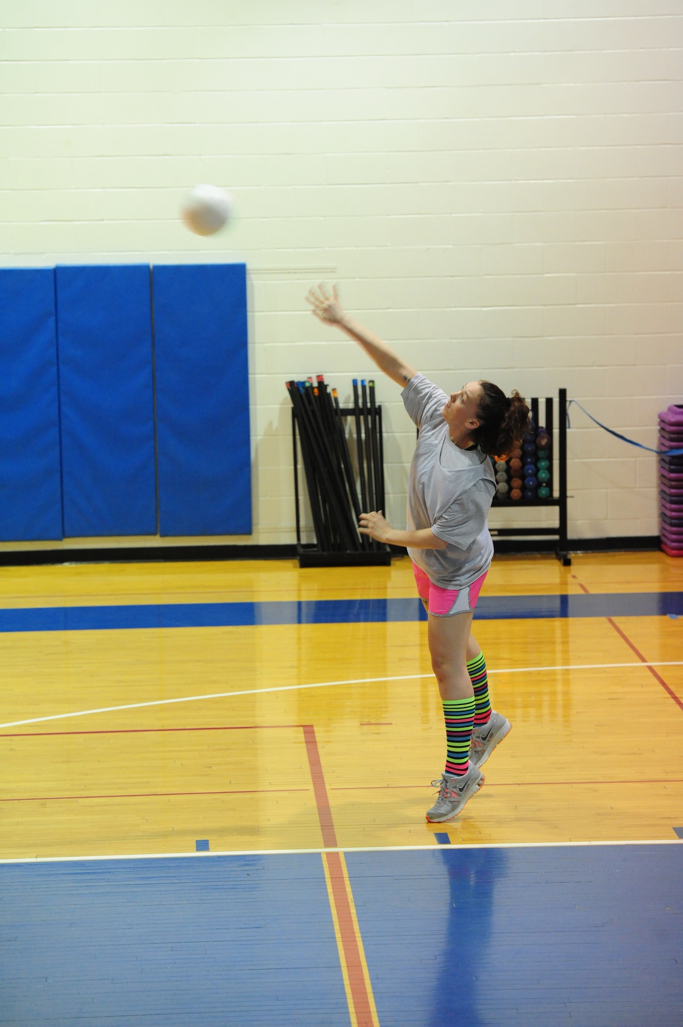 Sierra Phillips, 509th Force Support Squadron intramural volleyball team, serves the ball during the first half of a volleyball game against the 709th Munitions Support Squadron at the Fitness Center of Whiteman Air Force Base, Mo., Feb. 18, 2014. Team Whiteman’s intramural volleyball season began Feb. 10, and is scheduled to end March 18. Playoffs will begin March 24. (U.S. Air Force photo by Staff Sgt. Nick Wilson)