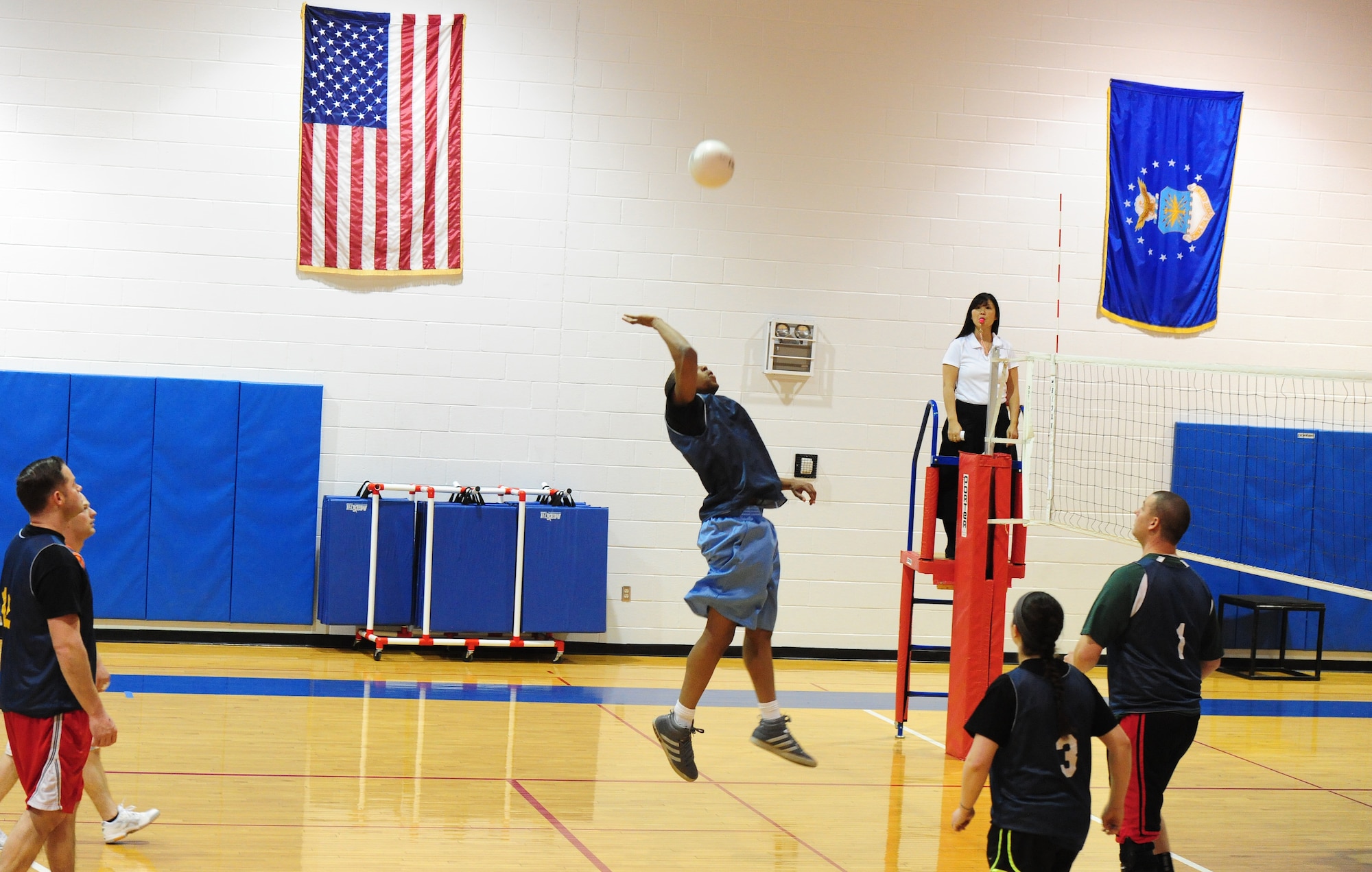 Desmond Reaves, 709th Munitions Support Squadron intramural volleyball team member, attempts a spike during the first half of a volleyball game against the 709th Munitions Support Squadron at the Fitness Center of Whiteman Air Force Base, Mo., Feb. 18, 2014. The 509th FSS defeated the 709th MUNS after two games one with an overall score of 50 to 34. (U.S. Air Force photo by Staff Sgt. Nick Wilson)