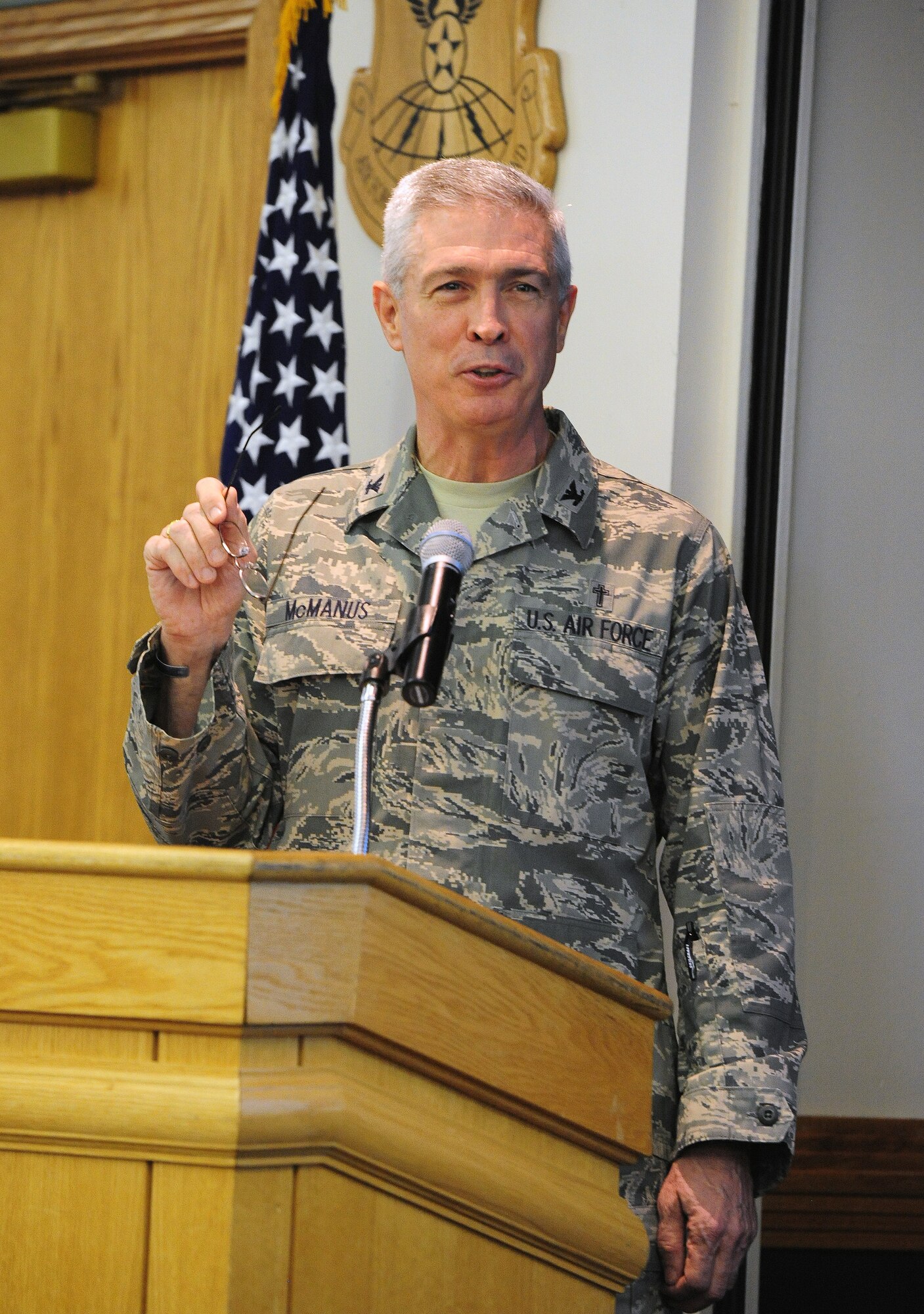 Chaplain (Col.) Gerald D. McManus, gives a speech during the National Prayer Breakfast at Mission’s End at Whiteman Air Force Base, Mo., Feb. 19, 2014. The National Prayer Breakfast, formerly known as the Presidential Prayer Breakfast, has roots in a rich tradition dating back to 1942 when leaders in the Senate and House of Representatives met weekly for prayer out of concern for the U.S.’s involvement in World War II. Service members continue the America's tradition of celebrating individual diverse faith backgrounds (U.S. Air Force photo by Staff Sgt. Nick Wilson/Released)