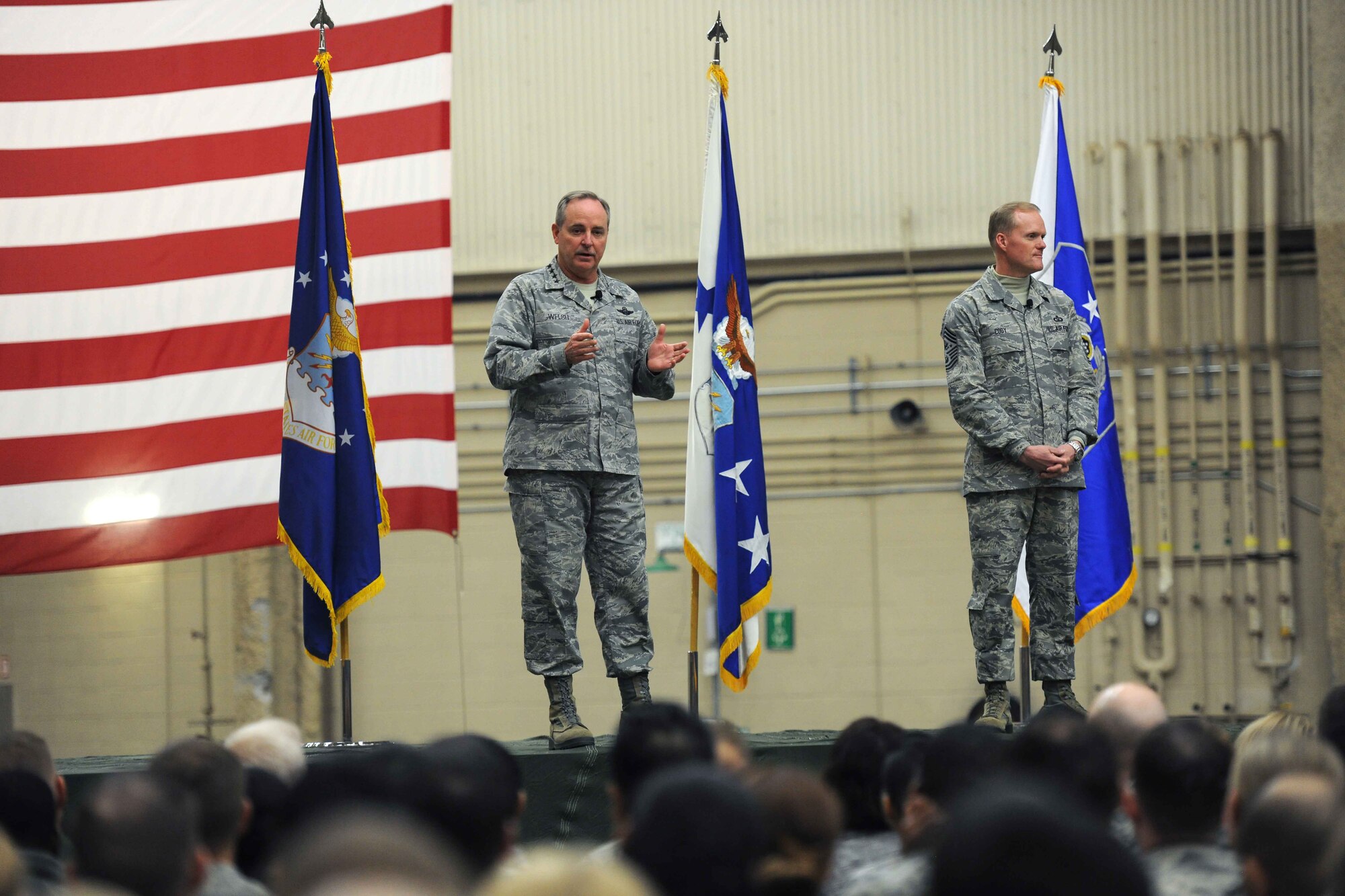 ALTUS AIR FORCE BASE, Okla. - Air Force Chief of Staff Gen. Mark A. Welsh III and Chief Master Sgt. of the Air Force James A. Cody speak with members of the 97th Air Mobility Wing inside Hangar 517, March 6, 2014. Welsh and Cody addressed various topics such as sequestration, force structure and sexual assault, and announced Altus as the Air Force's top installation. (U.S. Air Force photo by Senior Airman Jesse Lopez/Released)