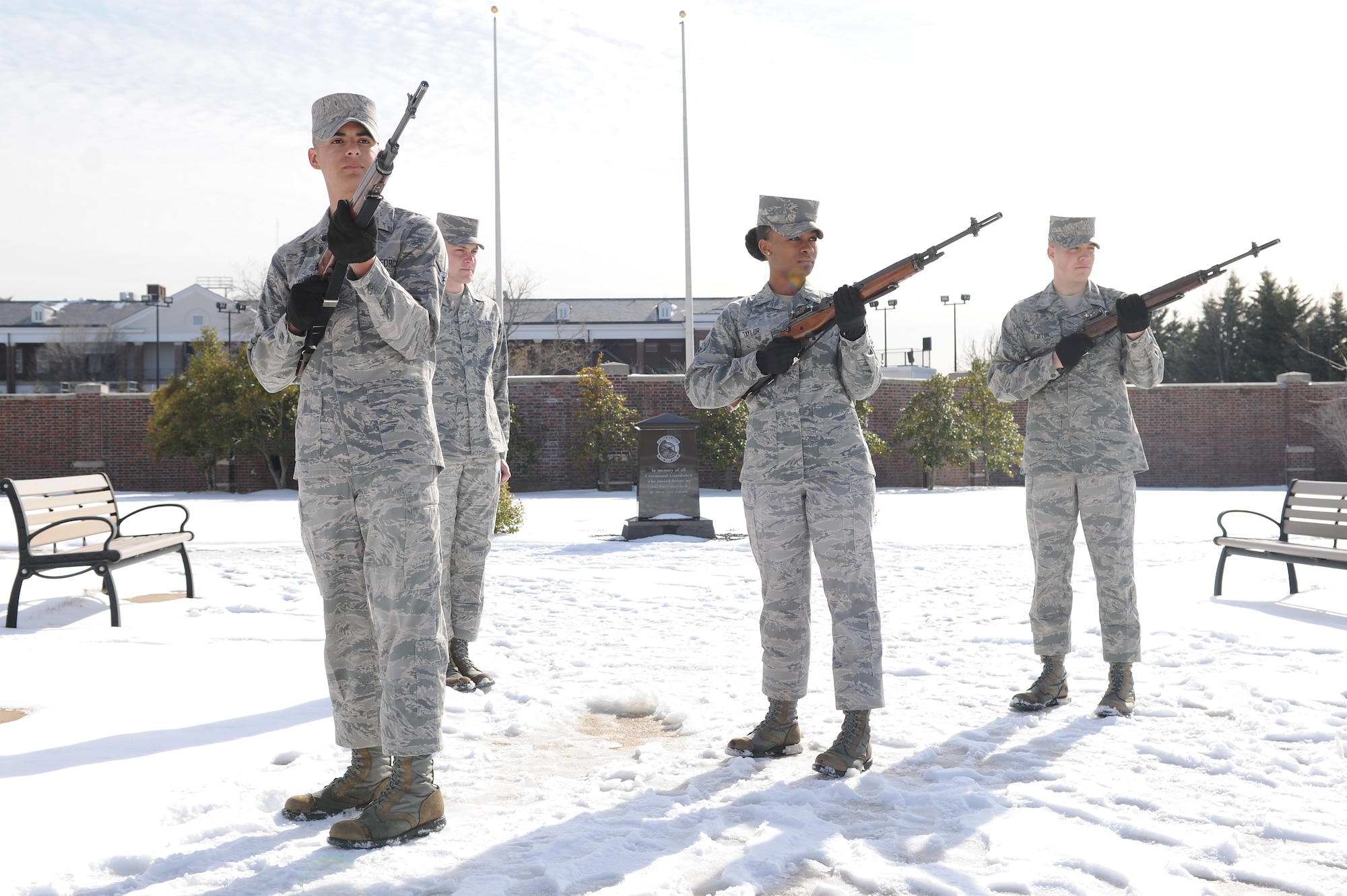 Airman 1st Class Grace Taylor (center) trains with members of the United States Air Force Honor Guard’s firing party at Joint Base Anacostia-Bolling, Washington, D.C., on March 4, 2014. Taylor, a tech school instructor, is still fully qualified to be on the firing party. The firing party performs the firing of three volleys during funeral services at Arlington National Cemetery. (U.S. Air Force photo/Airman 1st Class Ryan J. Sonnier)