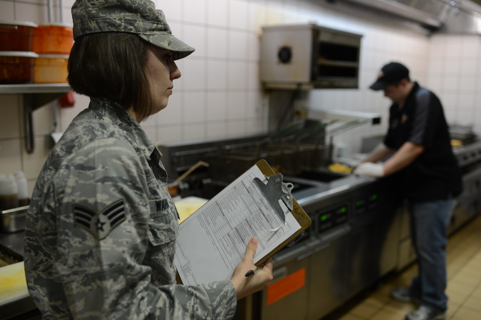 U.S. Air Force Senior Airman Misty Warner, 52nd Aerospace Medicine Squadron public health technician from Oglesby, Texas, inspects a food establishment at Spangdahlem Air Base, Germany, March 5, 2014. The public health office manages and performs public health activities and programs in support of the Aerospace Medicine Enterprise. (U.S. Air Force photo by Senior Airman Gustavo Castillo/Released) 