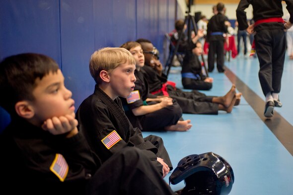 A handful of children wait for their upcoming sparring matches during the 2014 U.S. Air Forces in Europe and Air Forces Africa martial arts tournament March 1, 2014, Ramstein Air Base, Germany. The 2014 USAFE-AFFRICA martial arts tournament promotes good sportsmanship, healthy competition, and a way for children and teenagers to stay active. (U.S. Air Force photo/Airman 1st Class Jordan Castelan)