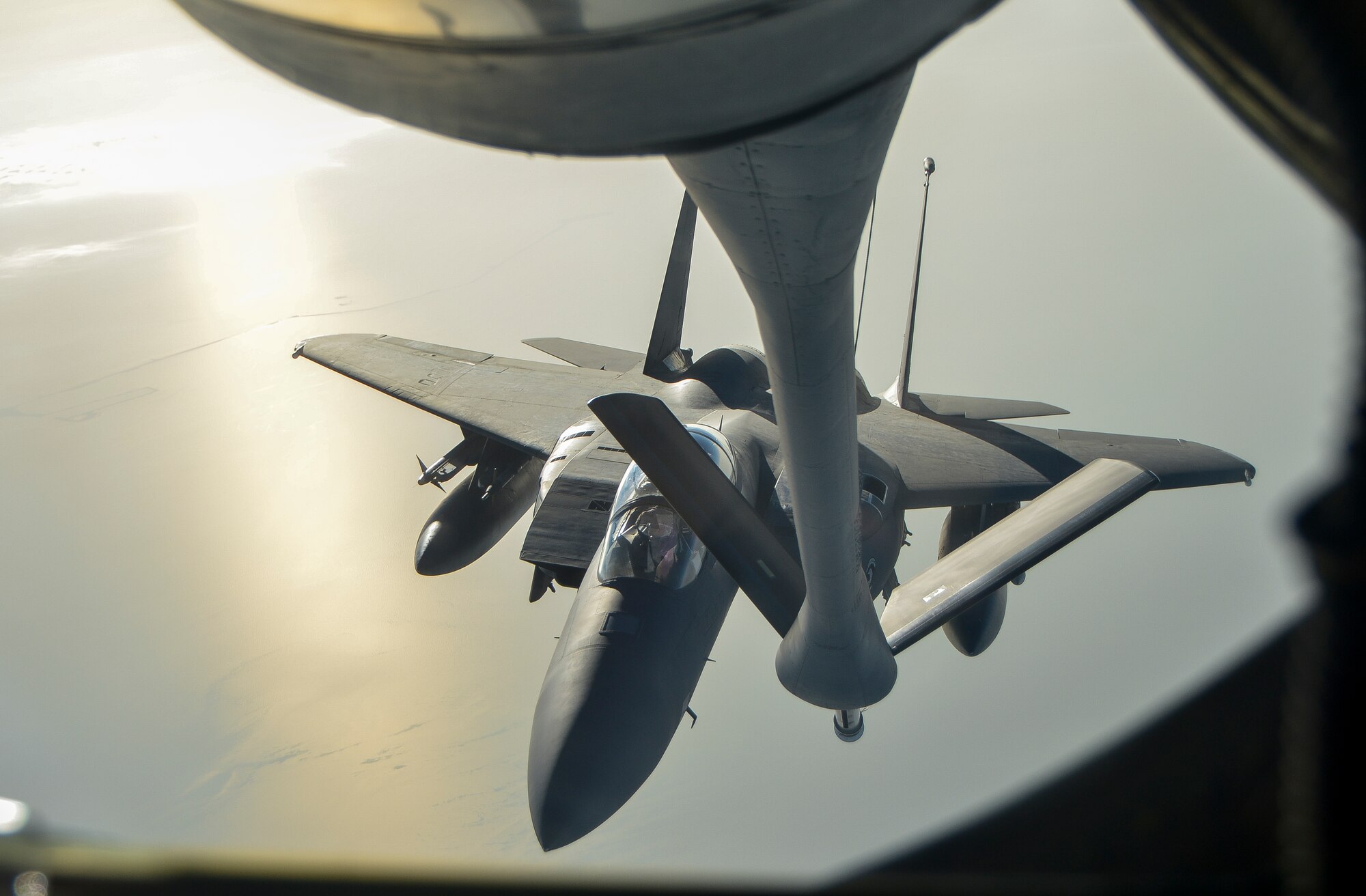 An F-15E Strike Eagle lines up with the refueling boom of a KC-135 Stratotanker from the 340th Expeditionary Air Refueling Squadron at an undisclosed location in Southwest Asia, Feb. 26, 2014. Airmen from the 340th EARS at Al Udeid Air Base, Qatar, make up the U.S. Air Forces Central Command’s area of responsibility main refueling squadron which supports the aircraft of Operation Enduring Freedom. Aerial refueling extends the capabilities of any aircraft by expanding the range, limited only by crew fatigue and fuel consumption of the aircraft. (U.S. Air Force photo/Senior Airman Jared Trimarchi) 