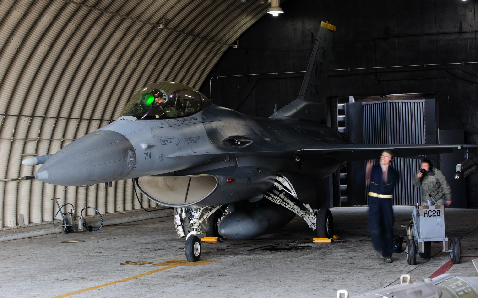 Capt. Philip Jackson, 8th Operations Support Squadron combat training chief, waits while crew chiefs ready the jet prior to a training sortie at Kunsan Air Base, Republic of Korea, Feb. 13, 2014. Jackson was one of two Wolf Pack pilots accepted into the Air Force’s test pilot school, where students are trained and tested on their ability to adapt and become an Air Force test pilot. (U.S. Air Force photo by Senior Airman Armando A. Schwier-Morales/Released)