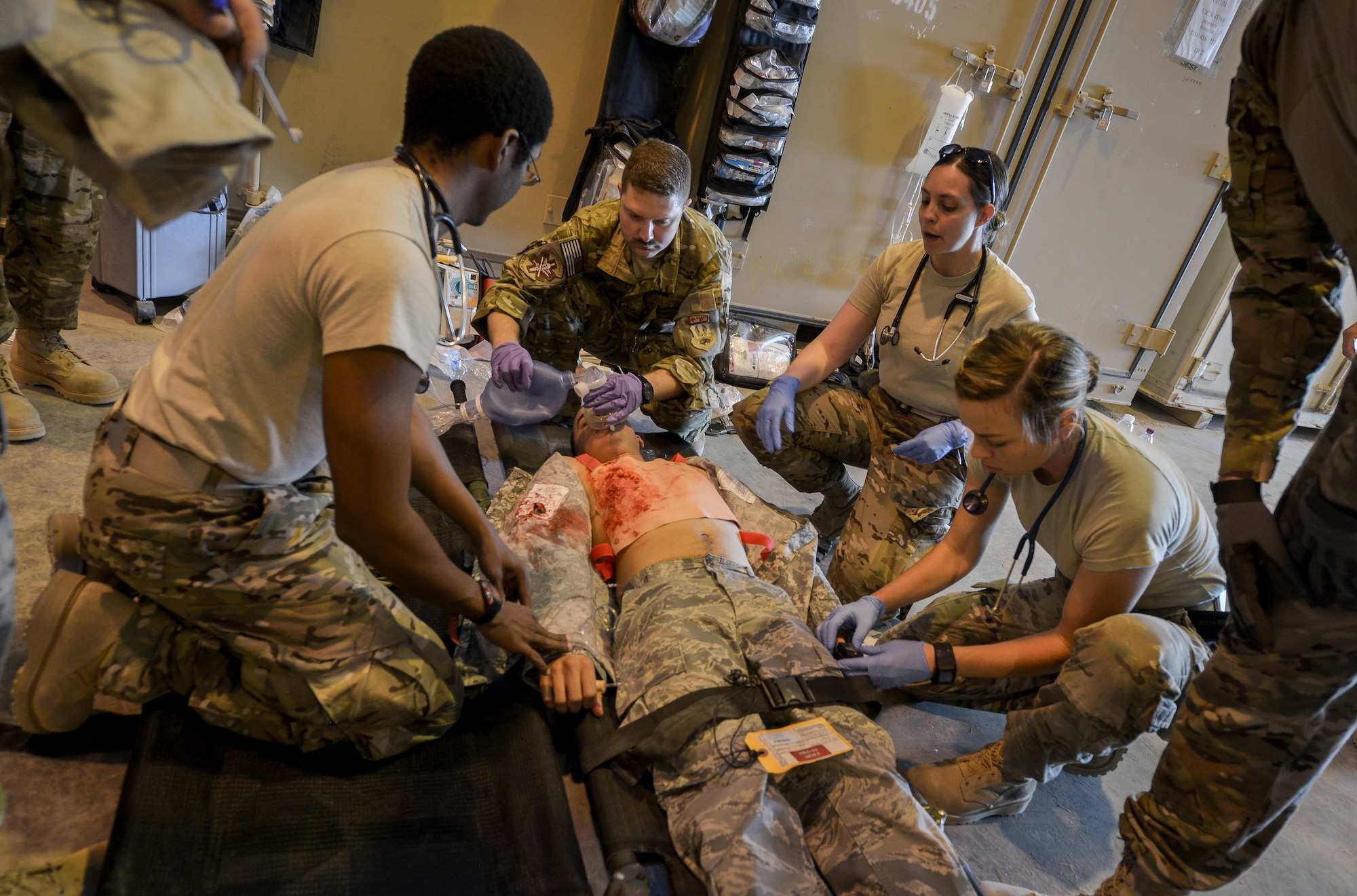 Airmen from the Mobile Field Surgical Team work on a simulated patient during a medical exercise at Al Udeid Air Base, Qatar, Feb. 27, 2014, to work on life-saving skills provided to wounded warriors. An MFST is a group of medical professionals who support forward operations throughout the U.S. Central Command's area of responsibility and Operation Enduring Freedom through advance trauma life support and critical care for service members wounded in combat. Mobile Field Surgical Teams act as a transition point to get patients to the next level of care and stabilize patients before they are able to be transported by air. (U.S. Air Force photo/Senior Airman Jared Trimarchi) 