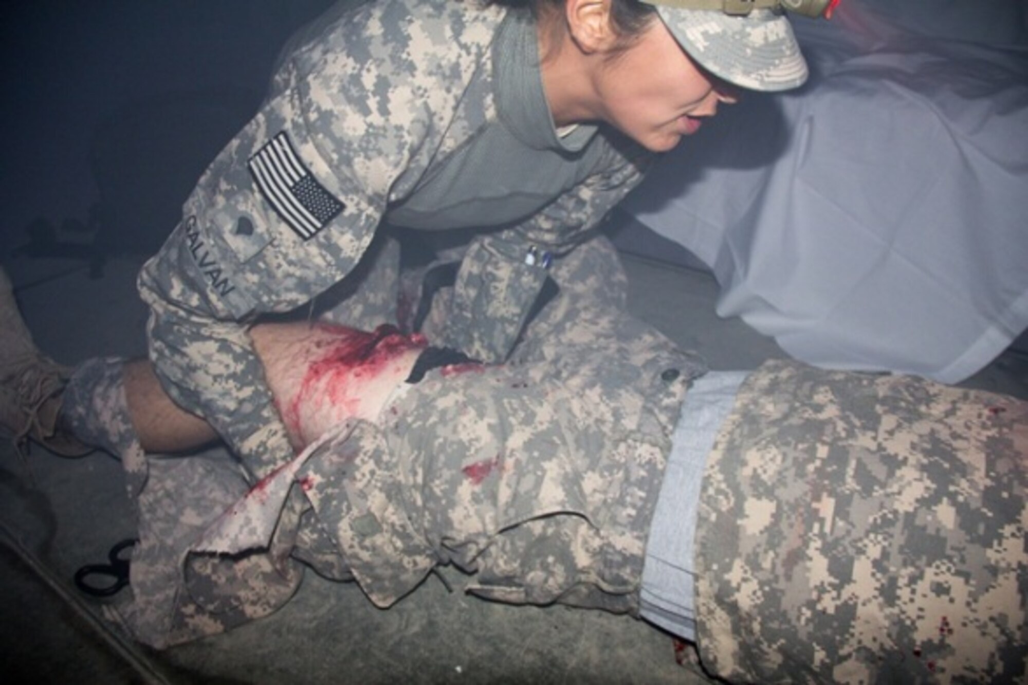 Spc. Vanessa Galvan a medic with 3-43 ADA assesses a simulated wound during the competition’s trauma lane. (Courtesy photo) 