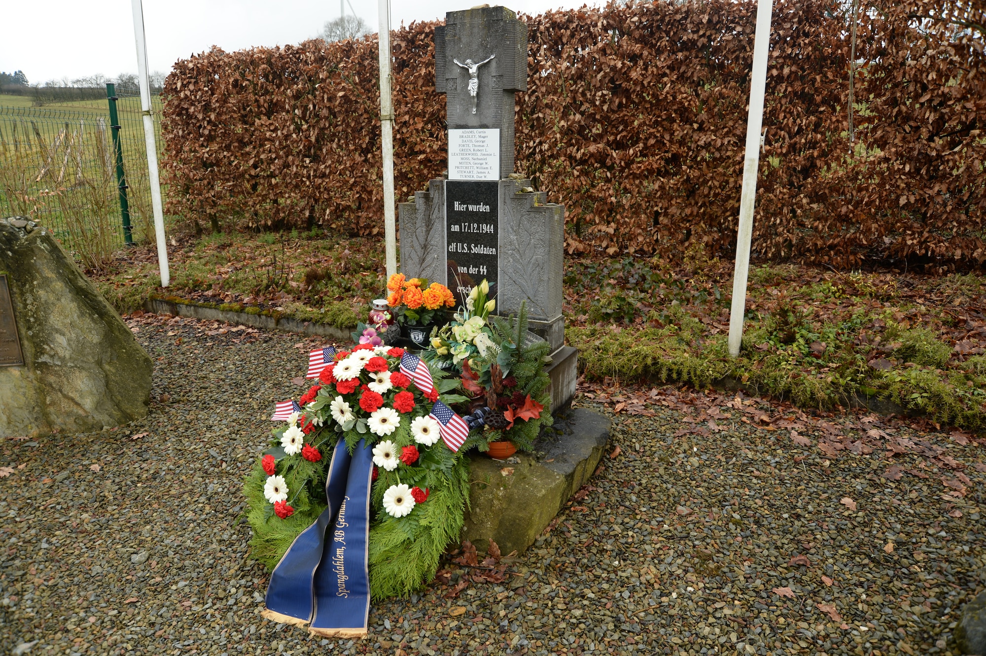 A wreath placed by members of the 52nd Civil Engineer Squadron, Spangdahlem Air Base, Germany, rests at the Wereth 11 Memorial site in Wereth, Belgium, Feb. 28, 2014. More than 20 Spangdahlem Airmen conducted the memorial ceremony, complete with a recording of a ceremonial volley and playing of the Belgian and U.S. national anthems, to honor the legacy of the 11 African-American Soldiers who were killed during the Battle of the Bulge in December 1944. (U.S. Air Force photo by Staff Sgt. Joe W. McFadden / Released) 