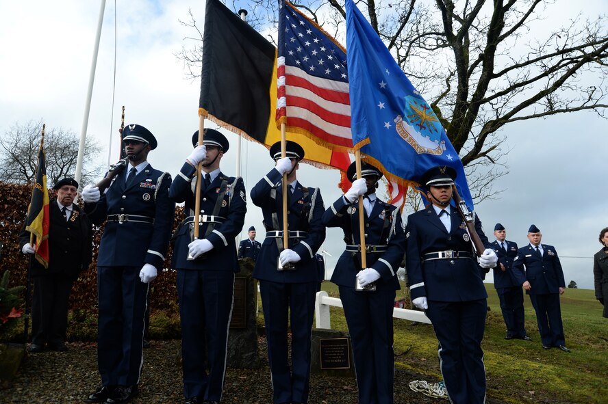 Spangdahlem Air Base Honor Guard members present the Belgian, U.S. and U.S. Air Force flags during a ceremony at the Wereth 11 Memorial site in Wereth, Belgium, Feb. 28, 2014. Spangdahlem Airmen conducted the service to honor the legacy of 11 African-American Soldiers killed during the Battle of the Bulge in December 1944. (U.S. Air Force photo by Staff Sgt. Joe W. McFadden / Released) 