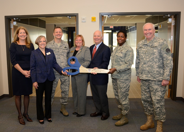 (L to R) Ms. Barbara Costello, Costello Construction representative, Mrs. Barbara Nemcheck, Project Manager for Burns & McDonnell, U.S. Air Force Brig. Gen. Scott Kelly, 175th Wing Commander, Baltimore County Councilwoman Cathy Bevins, U.S. Sen. Benjamin Cardin, Maryland, U.S. Air Force Brig. Gen. Allyson Solomon, Assistant Adjutant General-Air and U.S. Army Maj. Gen. James Adkins, Adjutant General Maryland National Guard celebrate the opening of the brand new 175th Wing  headquarters building during a ribbon cutting ceremony, March 8, 2014, at Warfield Air National Guard Base, Baltimore, Md.  The new 33,700 square foot facility was built to achieve LEED Silver Certified standards including multiple energy saving materials and systems. (U.S. Air National Guard photo by Tech. Sgt. Chris Schepers/RELEASED)